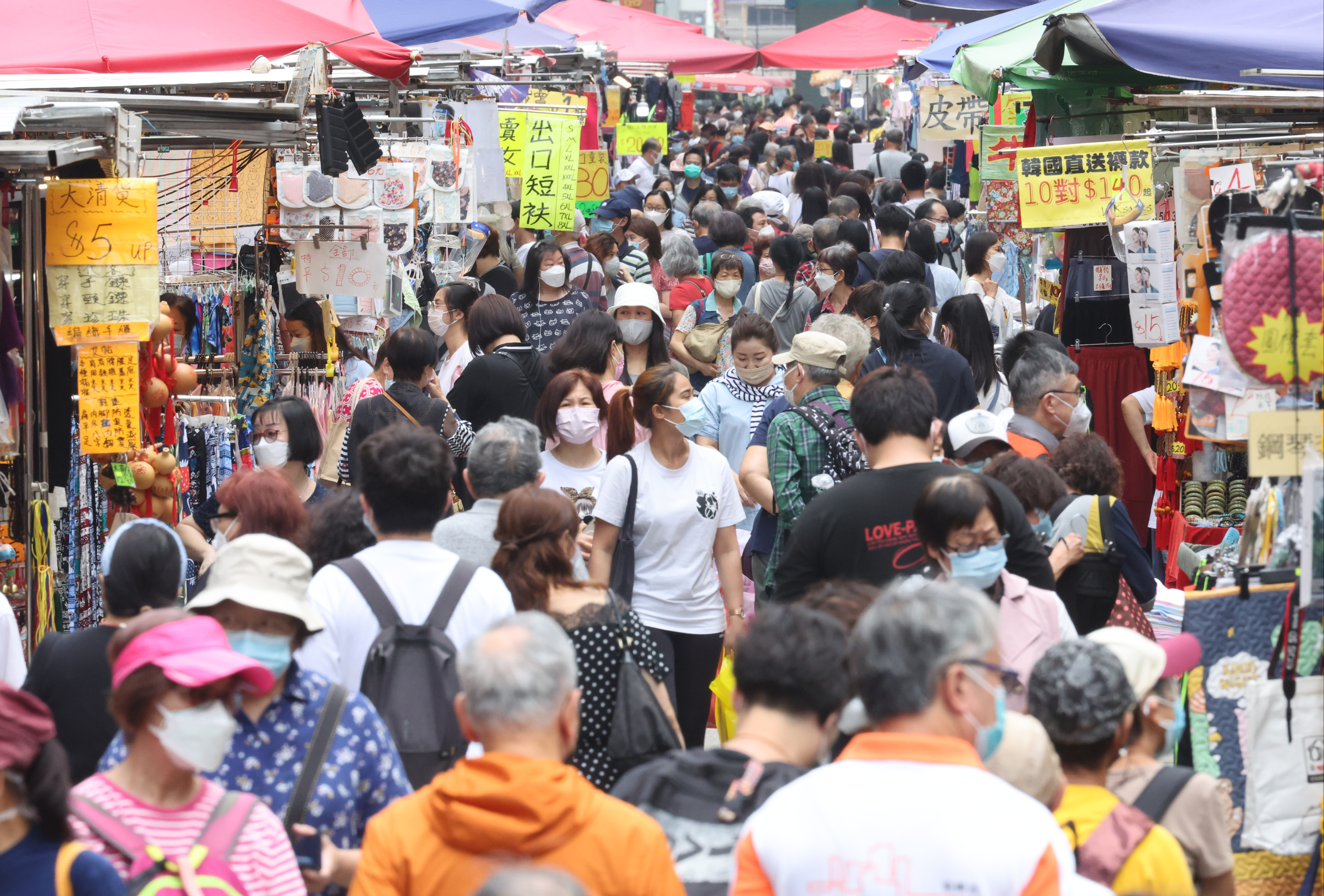 People visit a street market in Mong Kok on April 22, a day after some social distancing rules are eased. Photo: Edmond So 