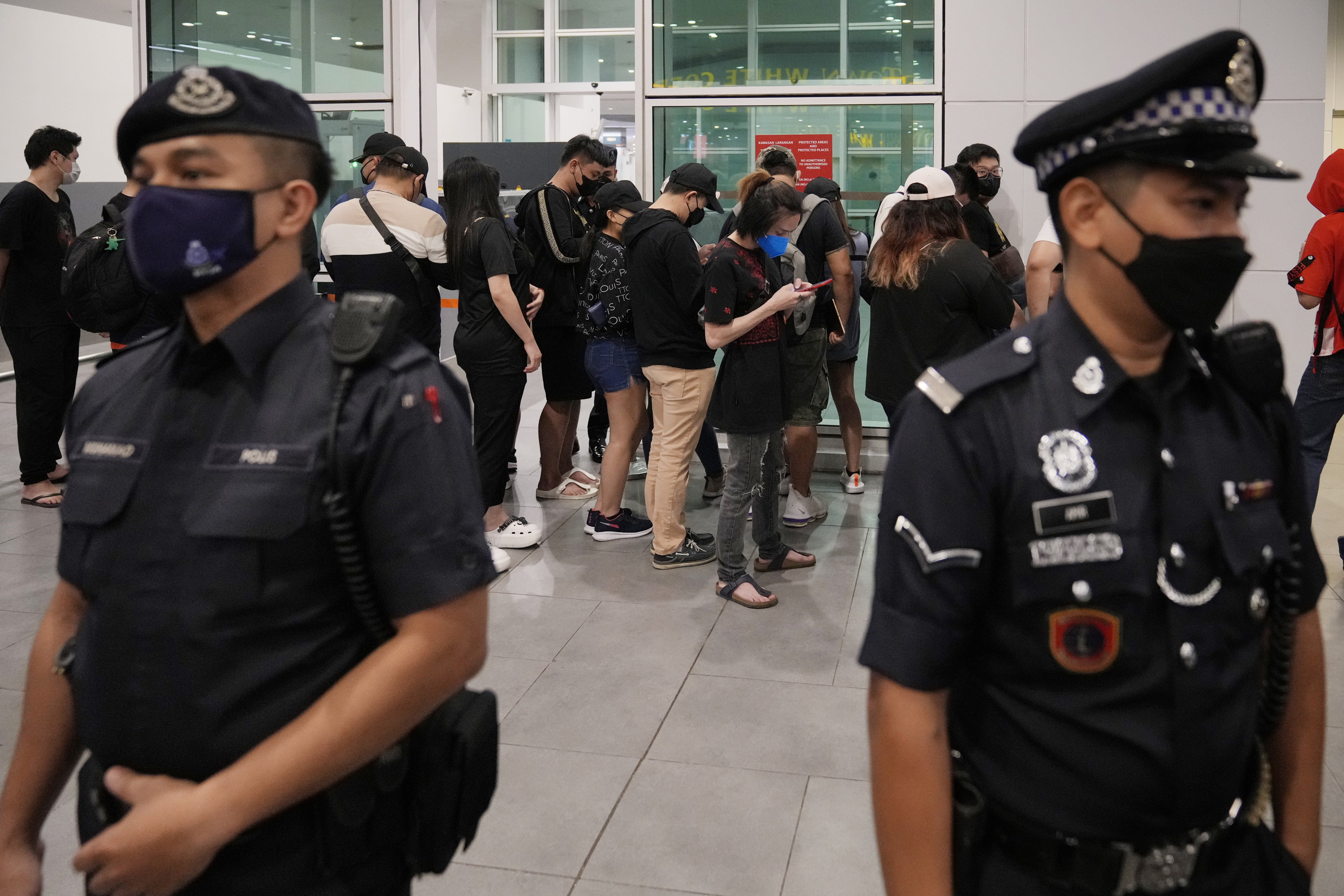 Malaysian youths arrive at Kuala Lumpur airport in September after being rescued from traffickers in Cambodia. Photo: AP