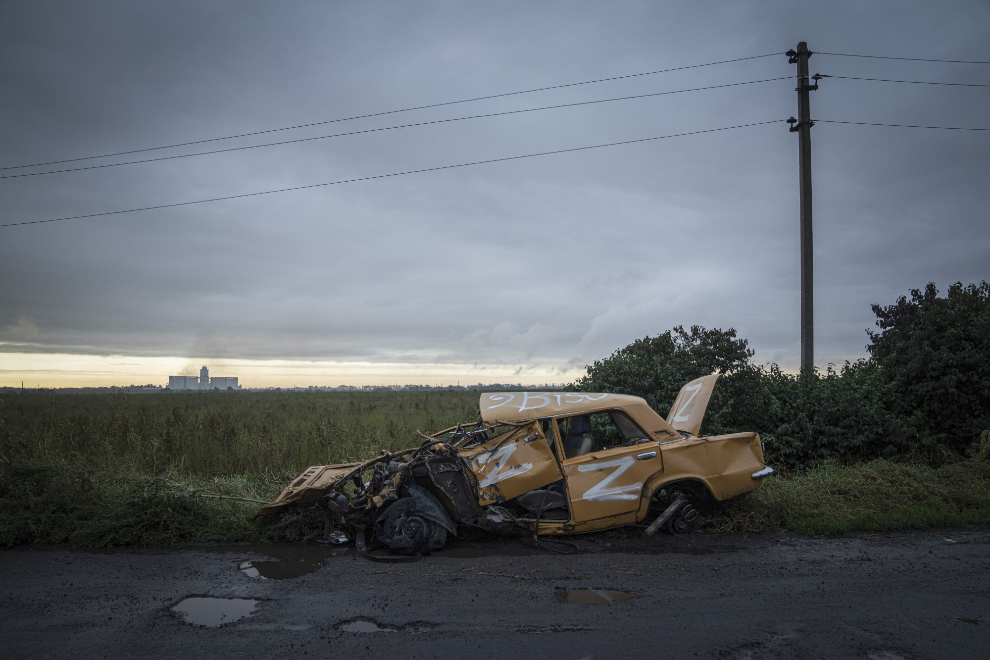 A destroyed vehicle with sign “Z” stands on the road near the city of Chuhuiv. Police said the Sri Lankans were picked up in the Chuhuiv area, about 70km from where they started. Photo: AP