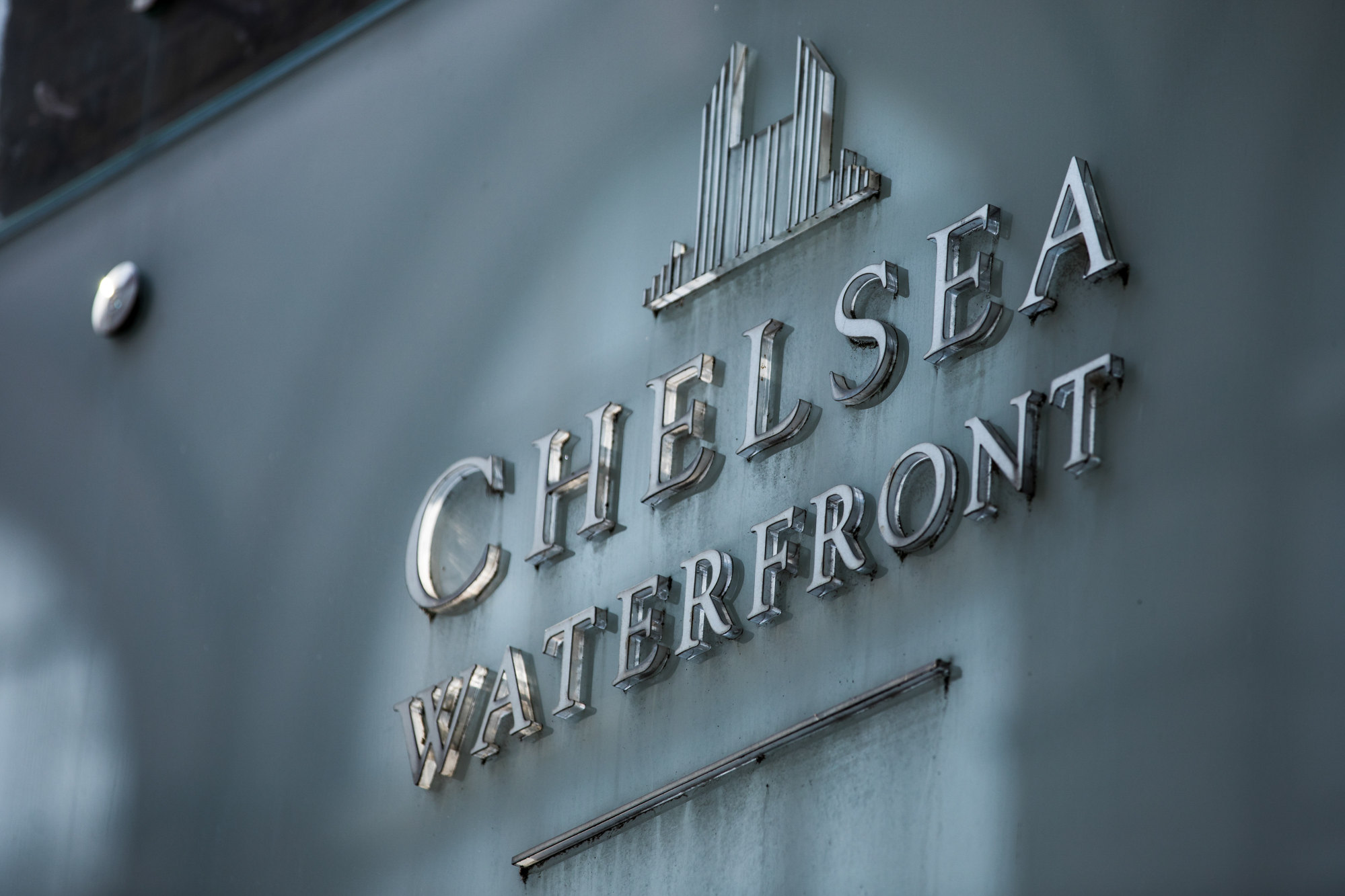 A sign sits on display outside the Chelsea Waterfront residential and commercial development in the Kensington and Chelsea borough of London. Photo: Bloomberg