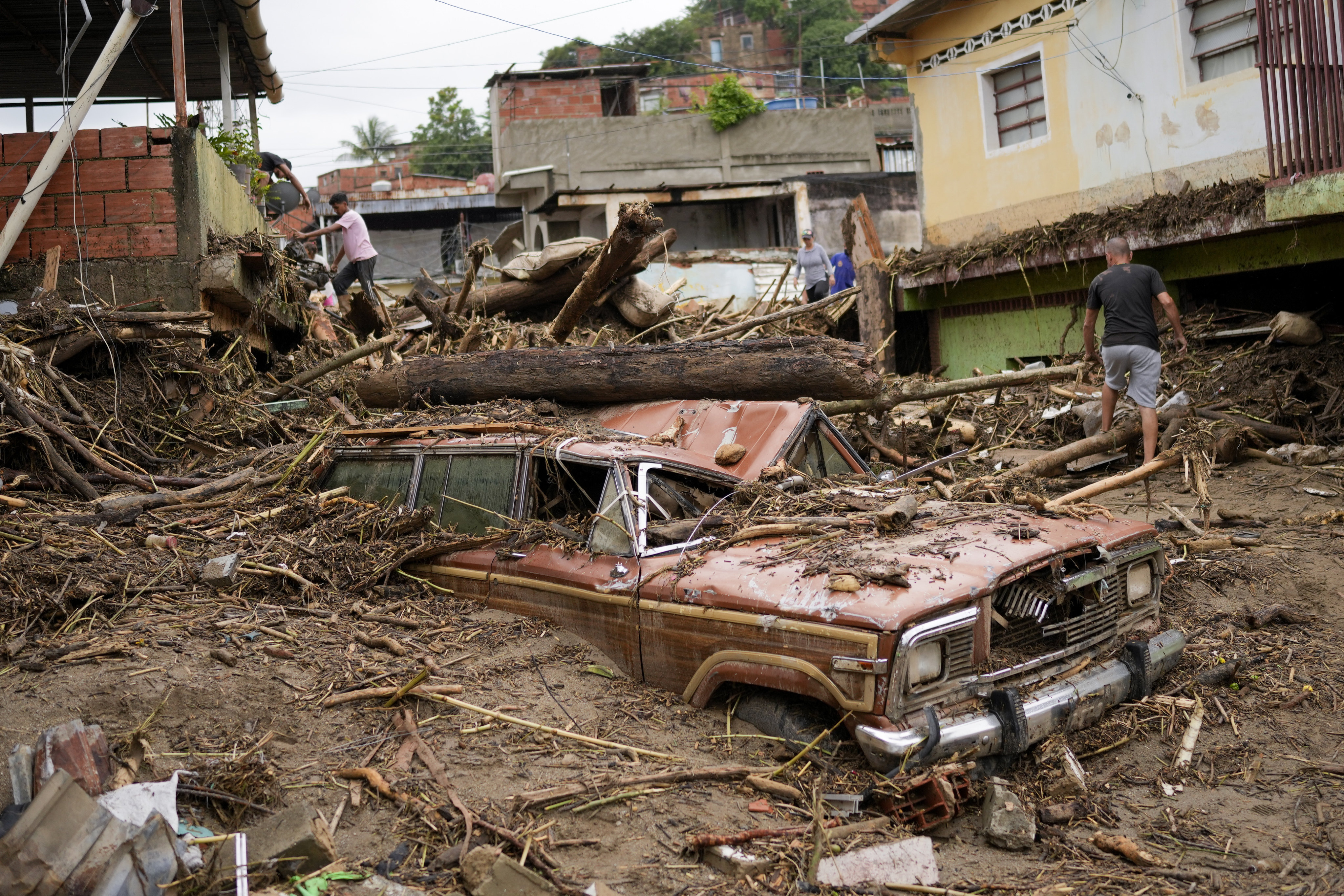 Debris left by flooding caused by a river that overflowed after days of intense rain in Las Tejerias, Venezuela. Photo: AP