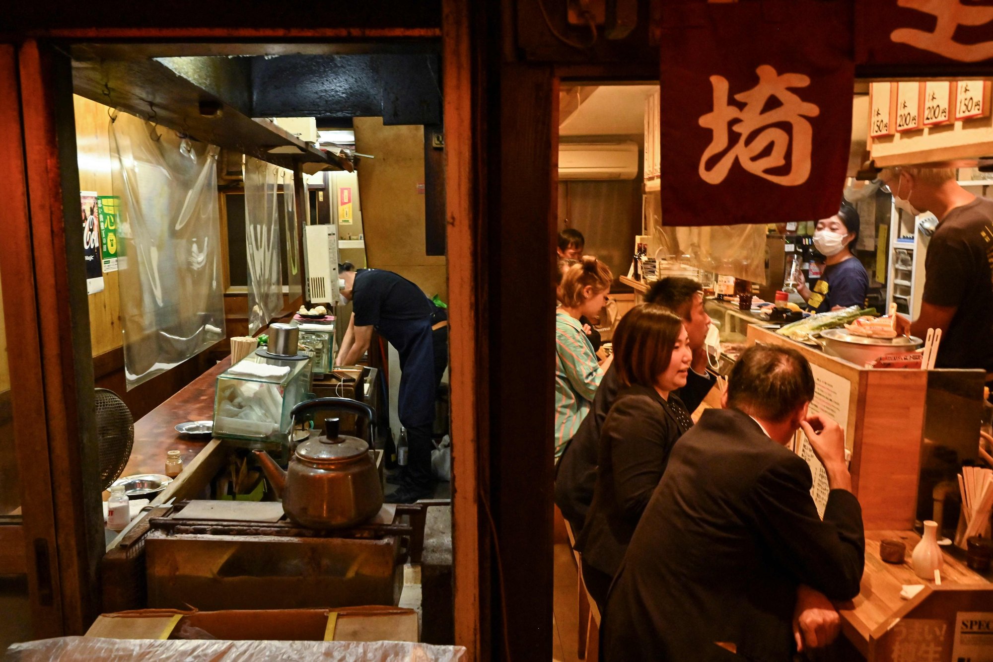 Travel bosses are pleased more visitors will be entering Japan, but there is some concern that many staff, including those in restaurants, are “out of practice” due to the pandemic. Photo: AFP