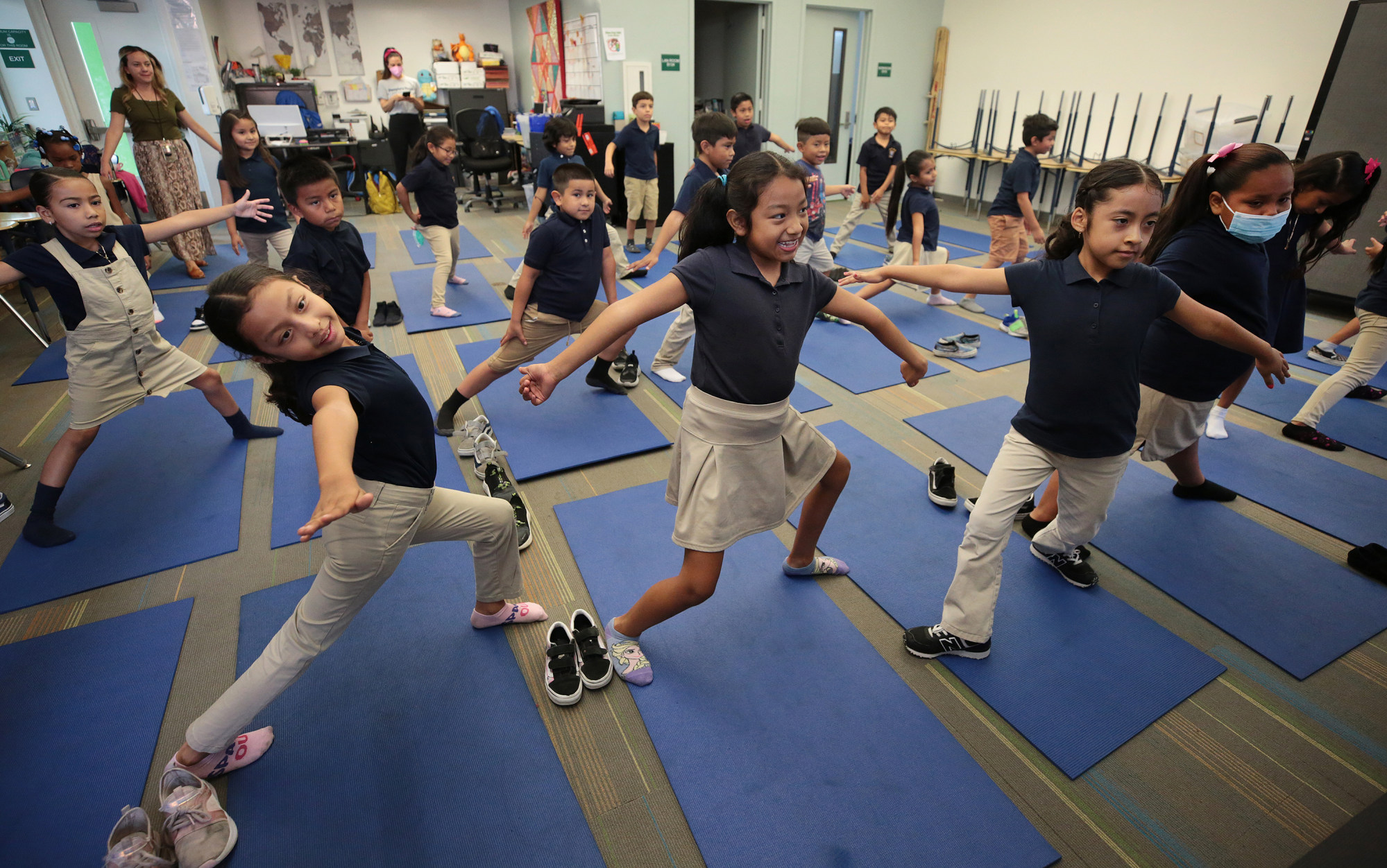 Accelerated Charter Elementary School students stretch during a yoga session. Photo: TNS