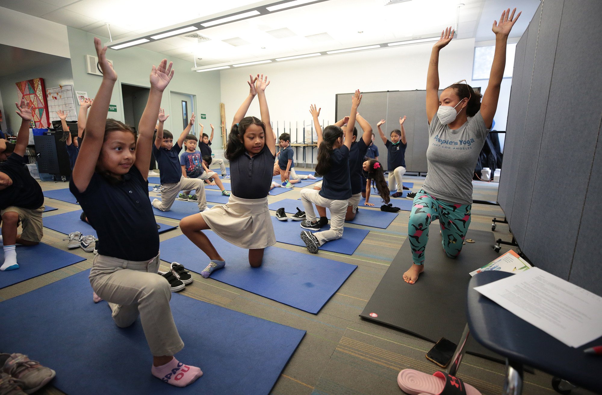 Students practise yoga poses at Accelerated Charter Elementary School. Photo: TNS