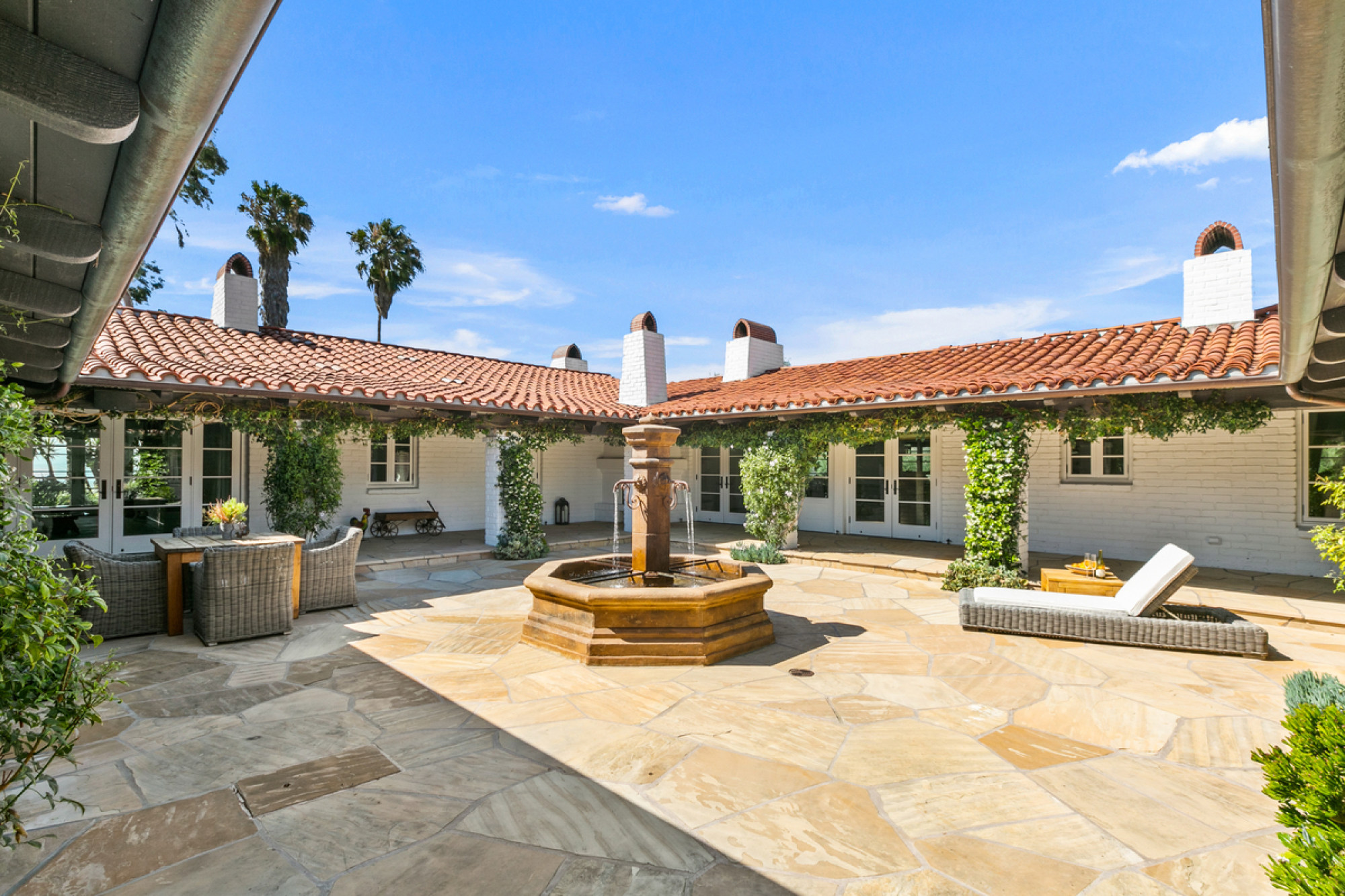 The courtyard and fountain at Sandra Bullock’s compound has a classic Spanish feel. Photo: ZenHouse Collective