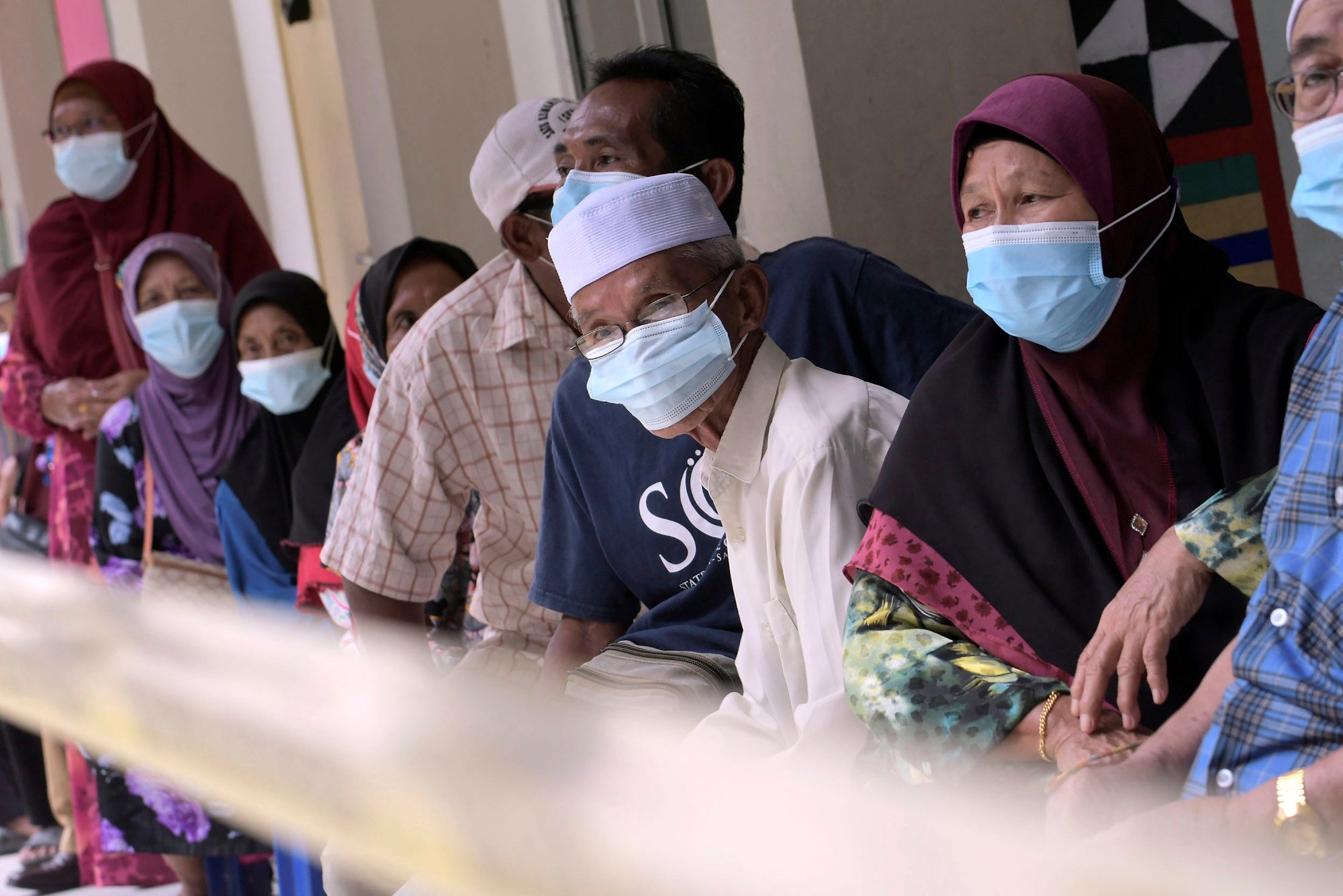 Voters wait to cast their ballots at a polling station on the outskirts of Kota Kinabalu, in Malaysia’s Sabah state, during a state election on September 26, 2020. Photo: AP