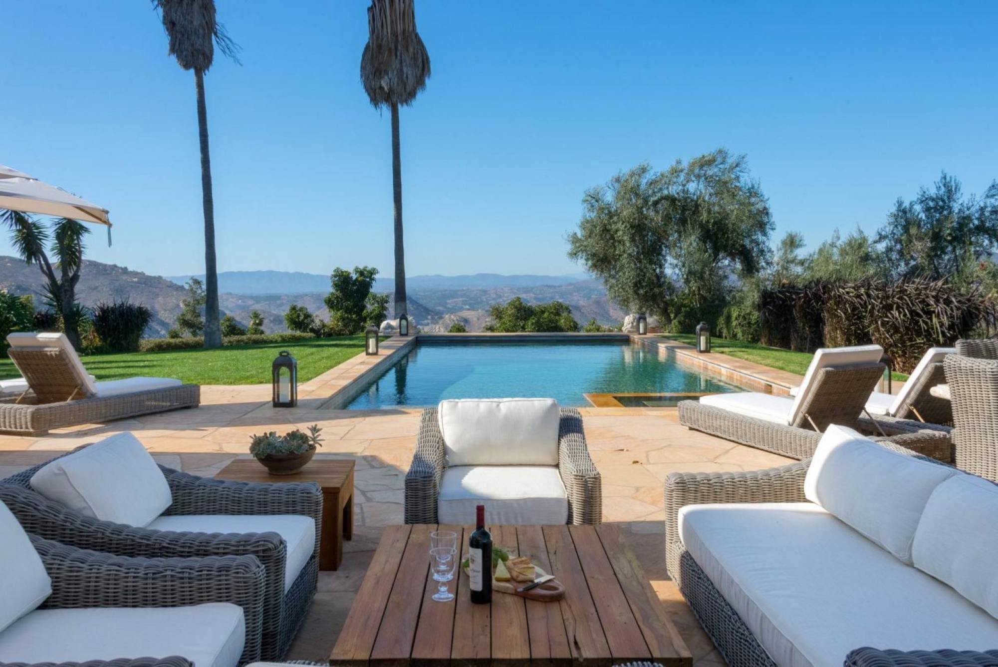 The poolside lounging space at Sandra Bullock’s compound in San Diego. Photo: ZenHouse Collective