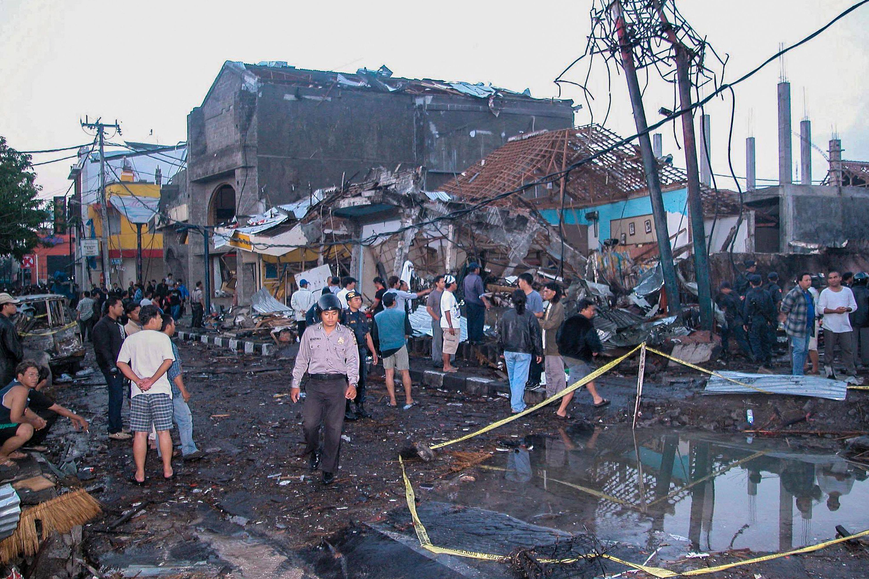 Police inspect the ruins of a nightclub destroyed by a blast in Kuta, Bali. File photo: AFP