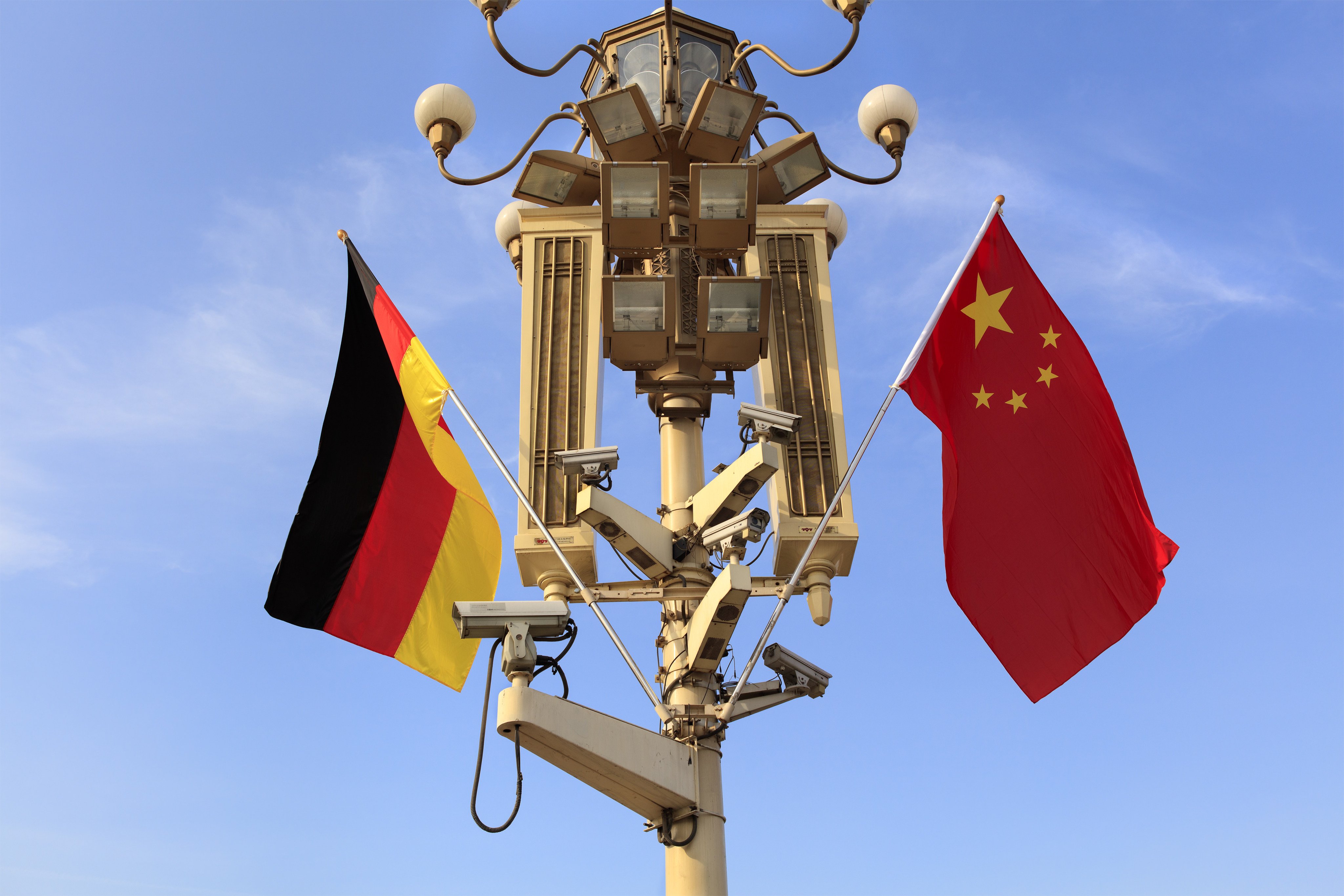German and Chinese national flags flutter on a lamppost at Tiananmen Gate during the visit of then German president Joachim Gauck in China in March 2016. Over the past 50 years, the relationship between Berlin and Beijing has been characterised by mutual respect, pragmatism and the will to benefit from each other. Photo: Shutterstock