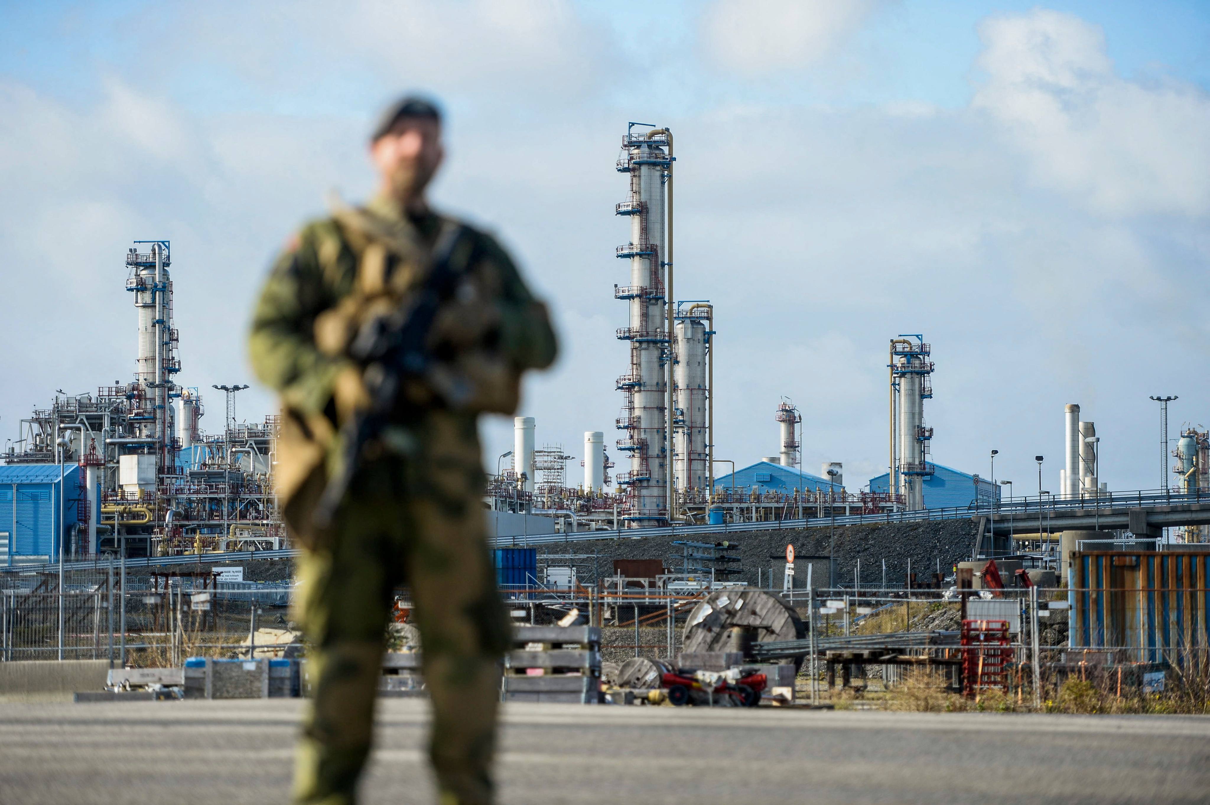 A Norwegian Home Guard soldier stands guard at the Karst gas processing plant in Rogaland, Norway, on October 3. Norway, now the biggest supplier of gas to Europe, has increased security around its oil installations following allegations of sabotage on Nord Stream’s Baltic Sea pipelines. Photo: AFP