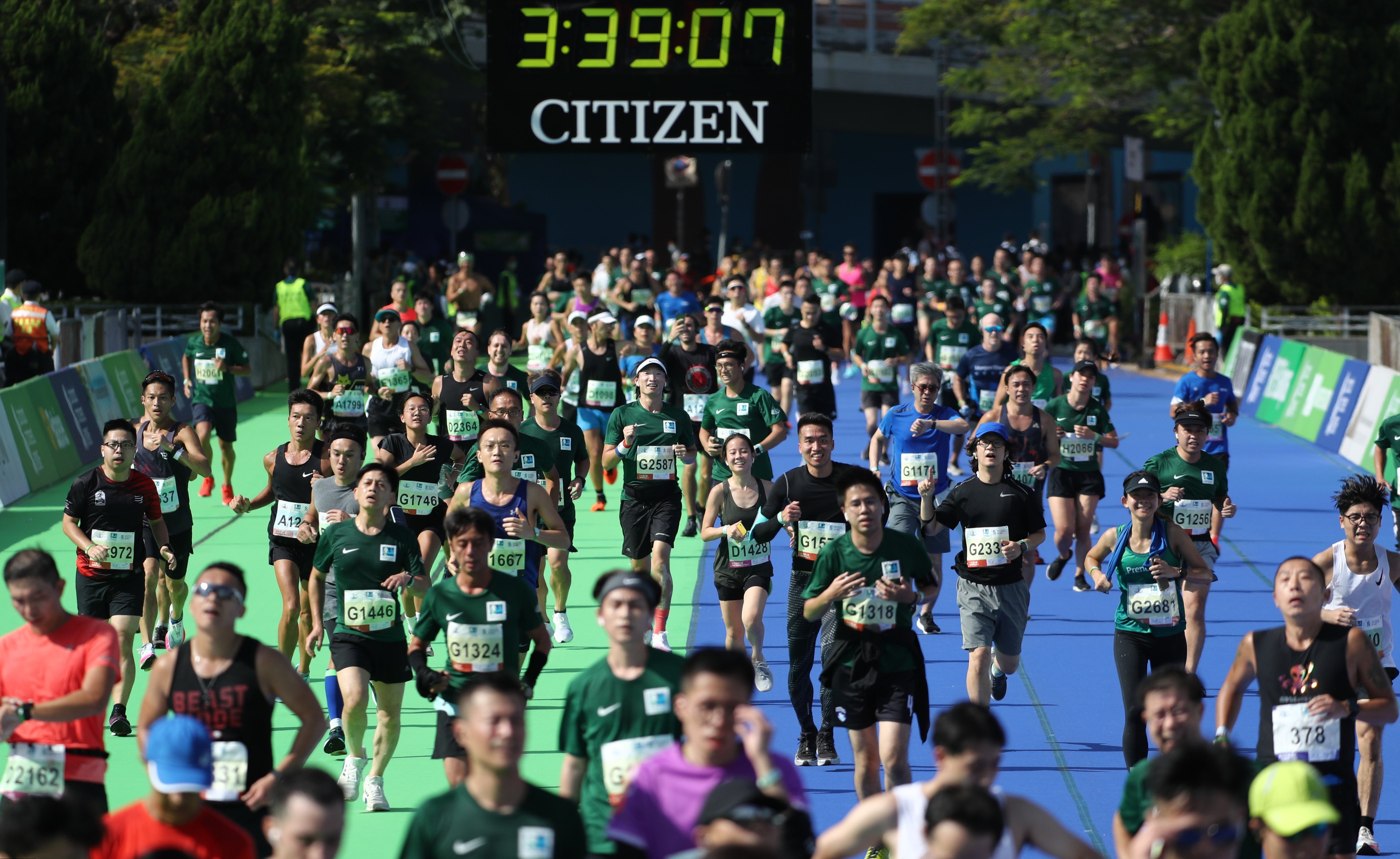 Runners arrive at Standard Chartered Hong Kong Marathon 2021 finish line at Victoria Park, Causeway Bay. Photo: Nora Tam