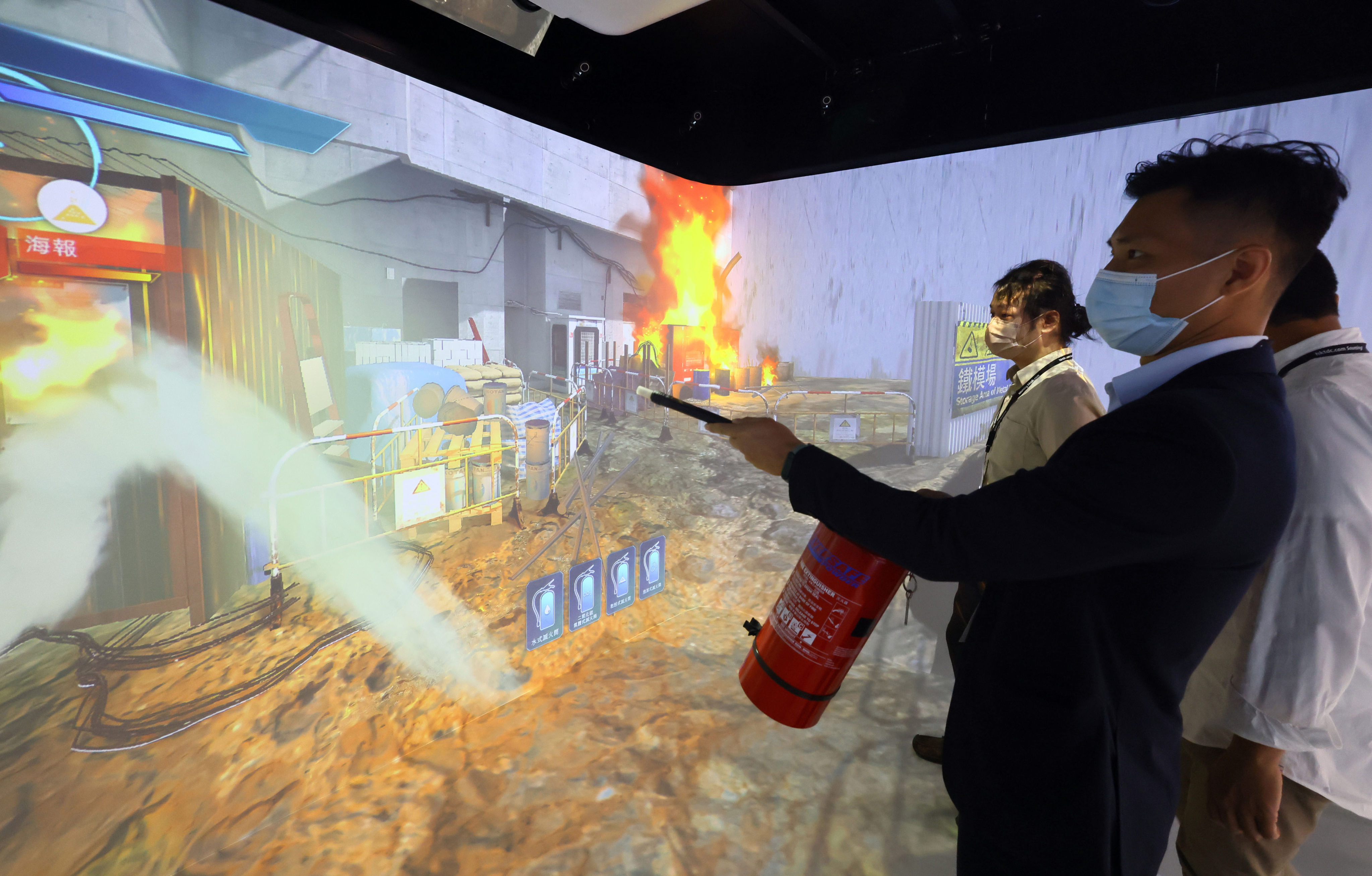 Trainees undergo fire safety drills in the Cave Automatic Virtual Environment. Photo: Dickson Lee