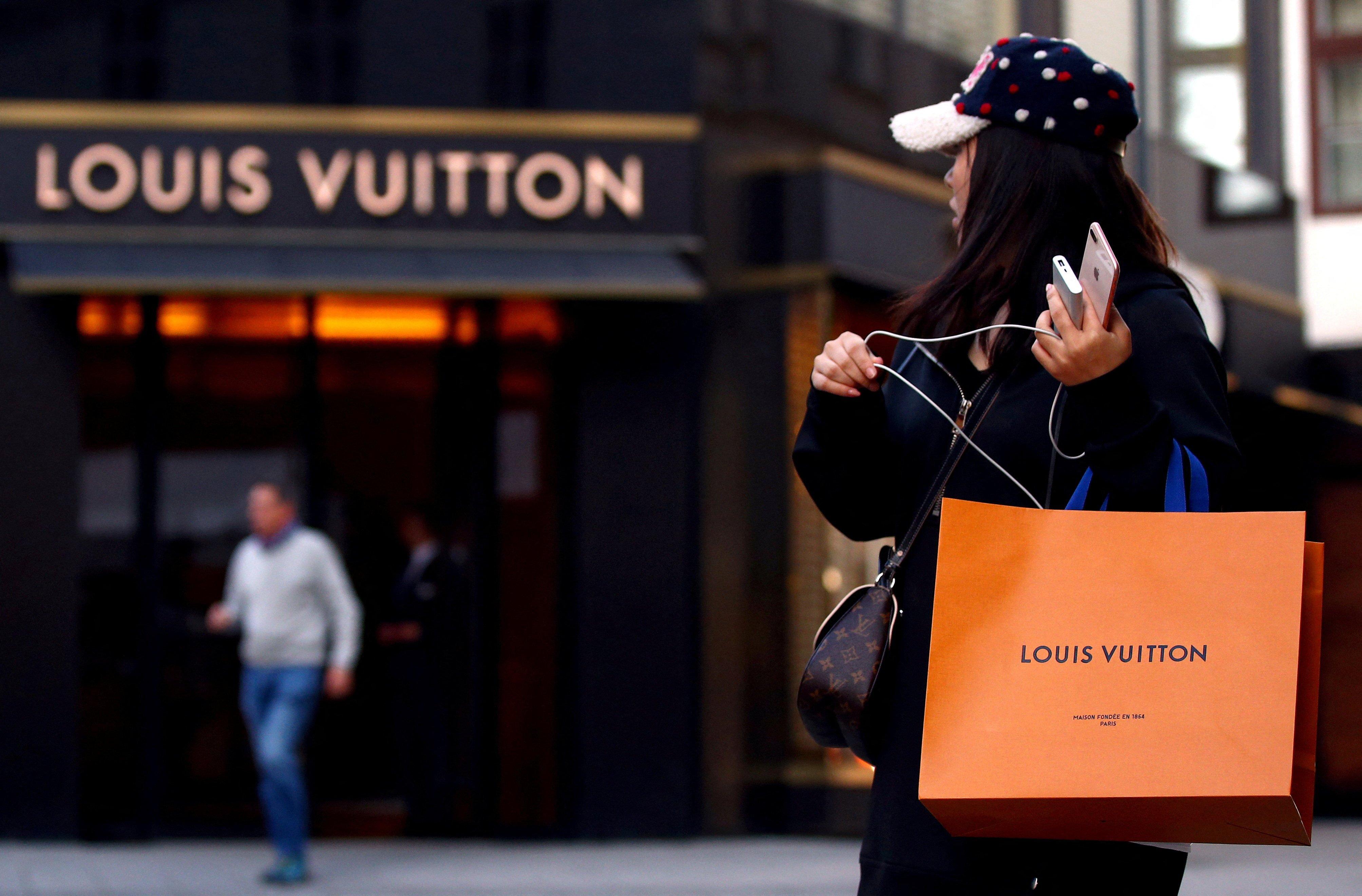 A woman with a Louis Vuitton branded shopping bag in Vienna, Austria, where sales of luxury goods are soaring for LVMH’s brands thanks to returning American tourists. Photo: Reuters