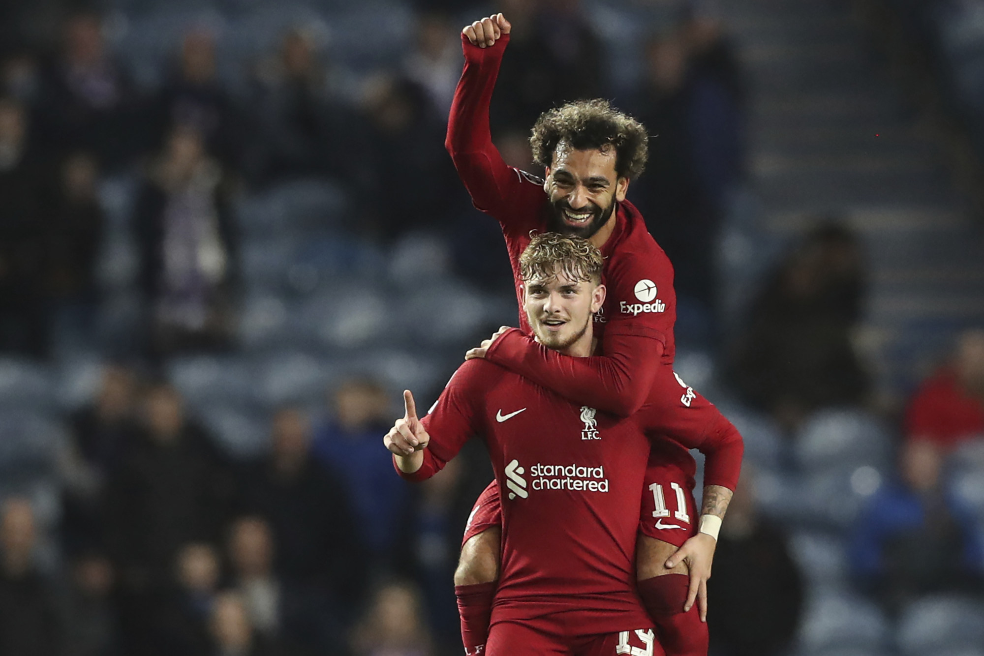 Liverpool’s Harvey Elliott celebrates after scoring his side’s seventh goal with Mohamed Salah during the Champions League match at Rangers. Photo: AP