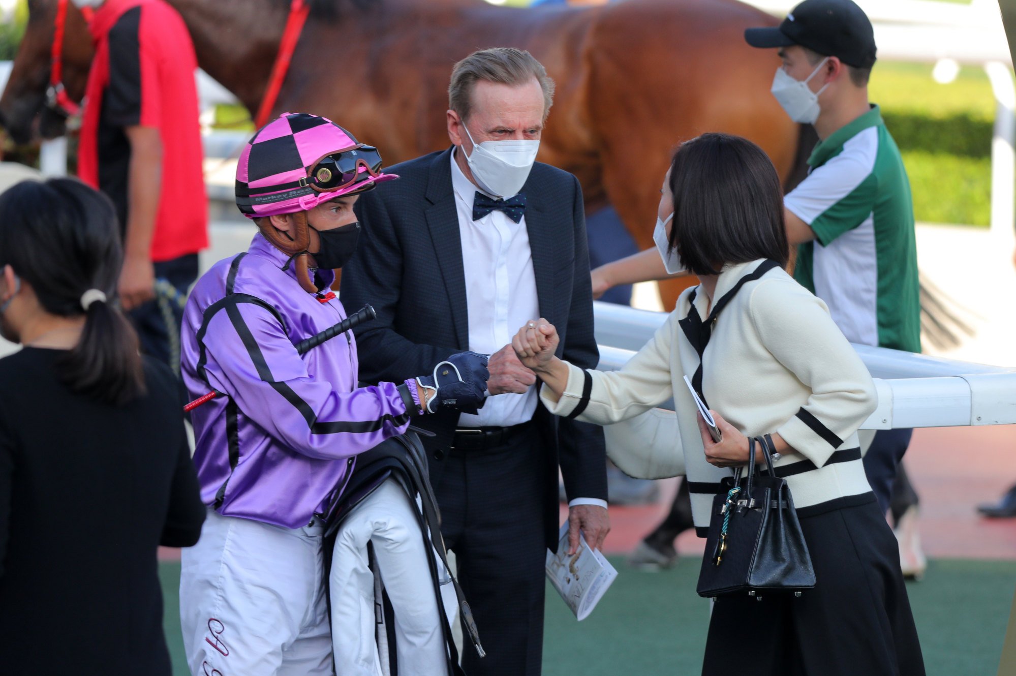 Jockey Alexis Badel and trainer John Size celebrate Sweet Encounter’s victory with connections.