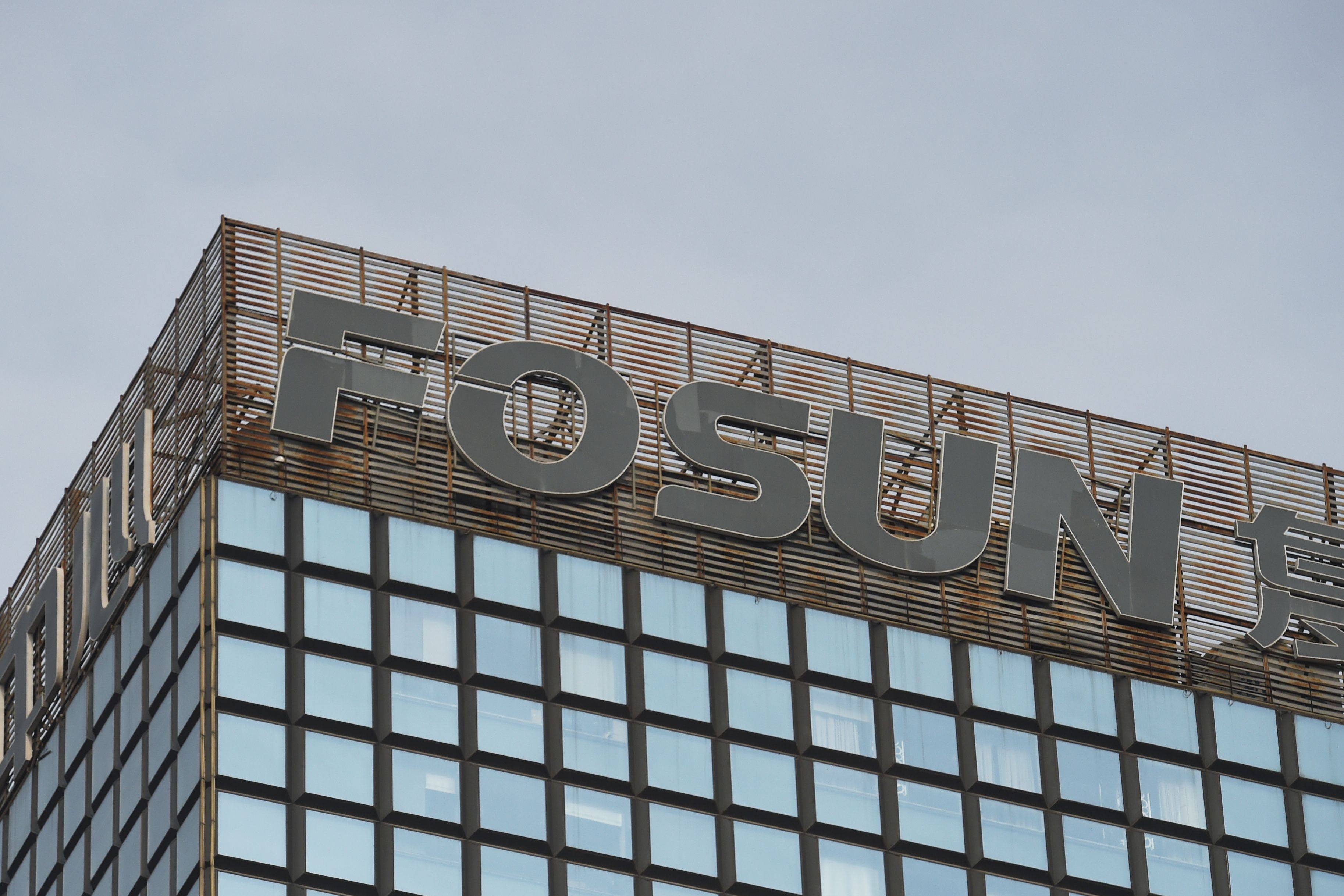 The logo of Chinese conglomerate Fosun is seen on top of a building in Beijing. Photo: AFP