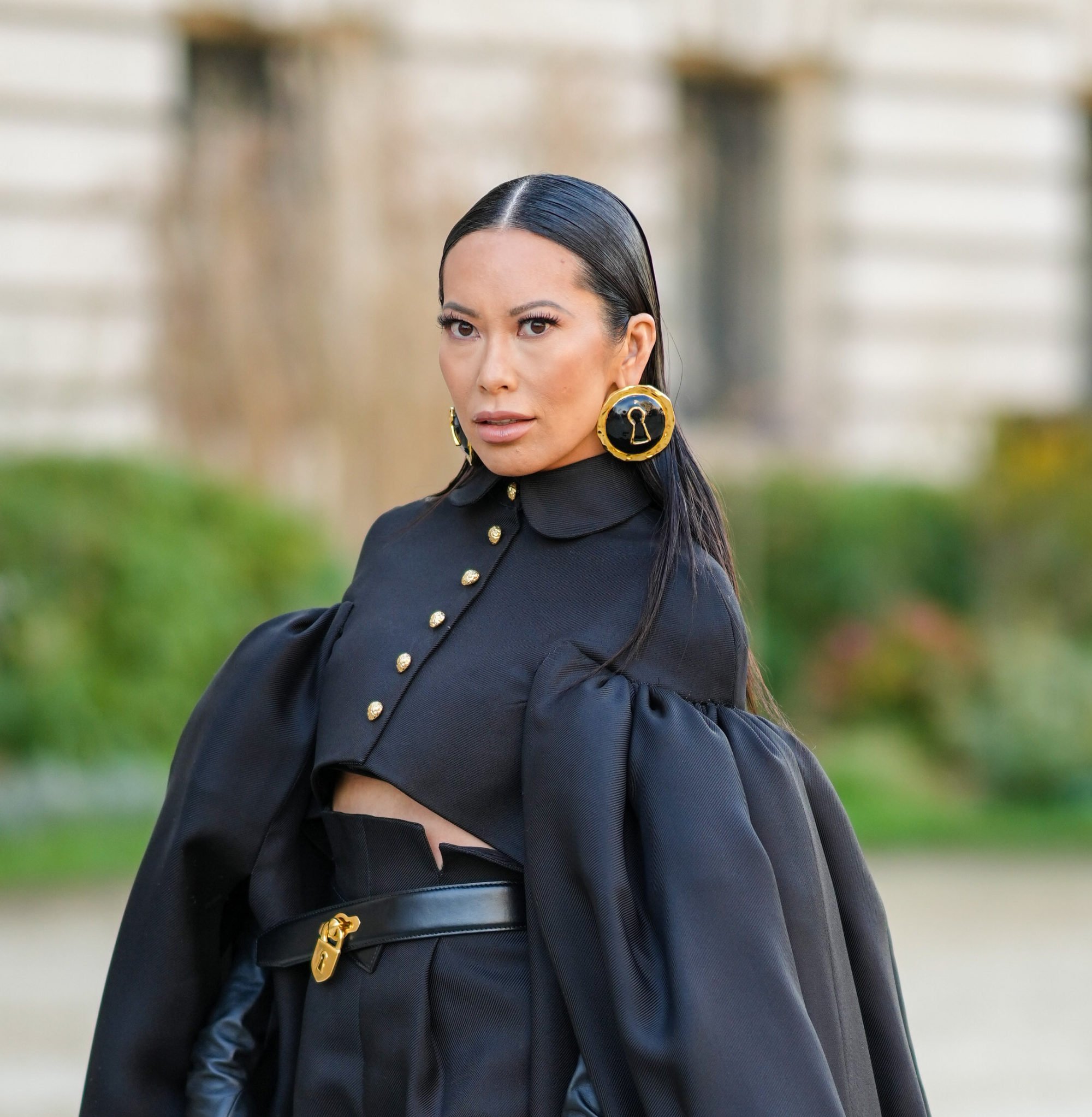 Christine Chiu wears a pair of oversized black Schiaparelli earrings featuring a lock design with gold borders during Paris Fashion Week, on January 24, in Paris, France. Photo: Getty Images