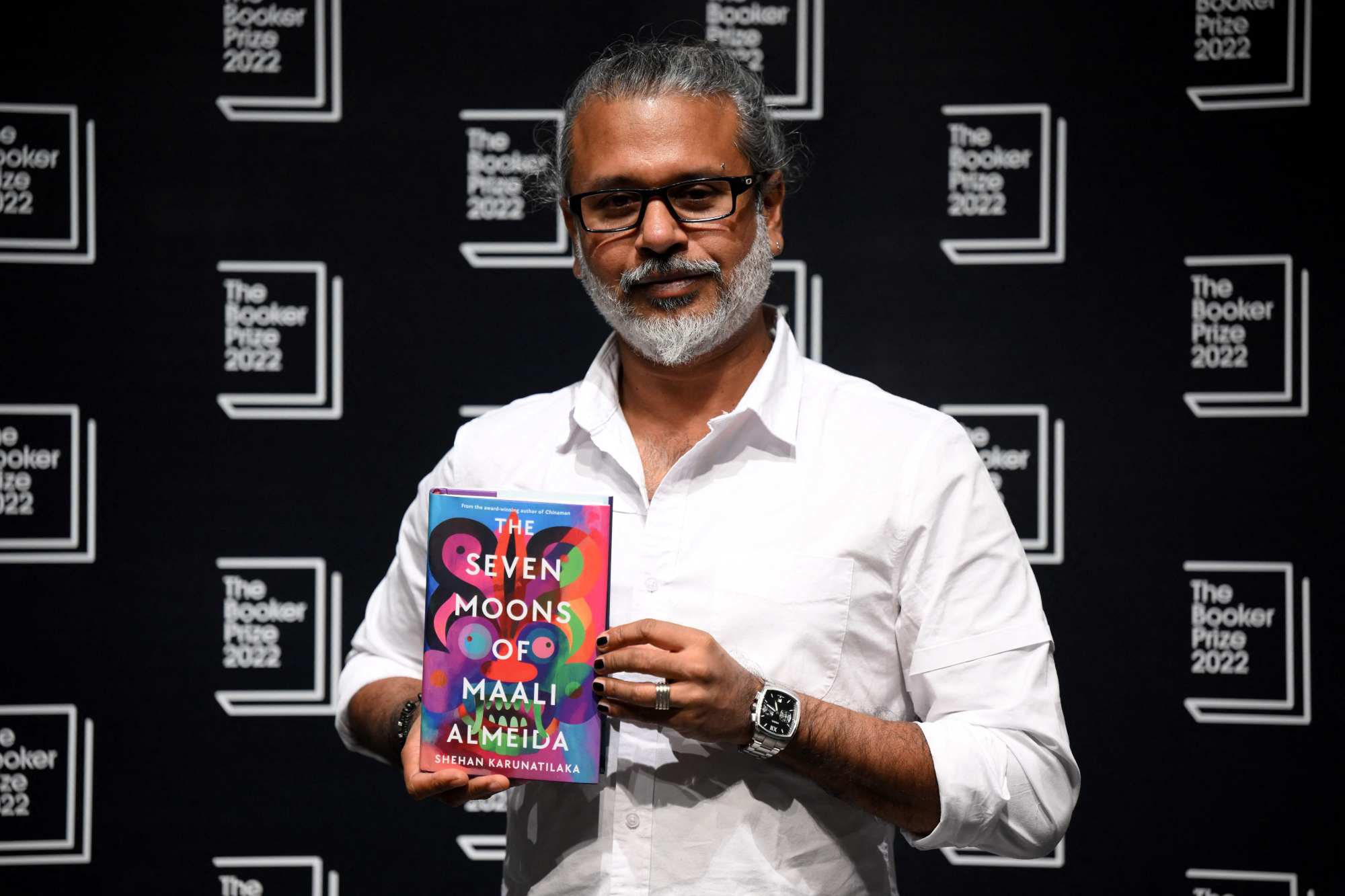 Sri Lankan author Shehan Karunatilaka holds his book The Seven Moons of Maali Almeida at the Shaw Theatre in King’s Cross in London on Friday. Photo: AFP