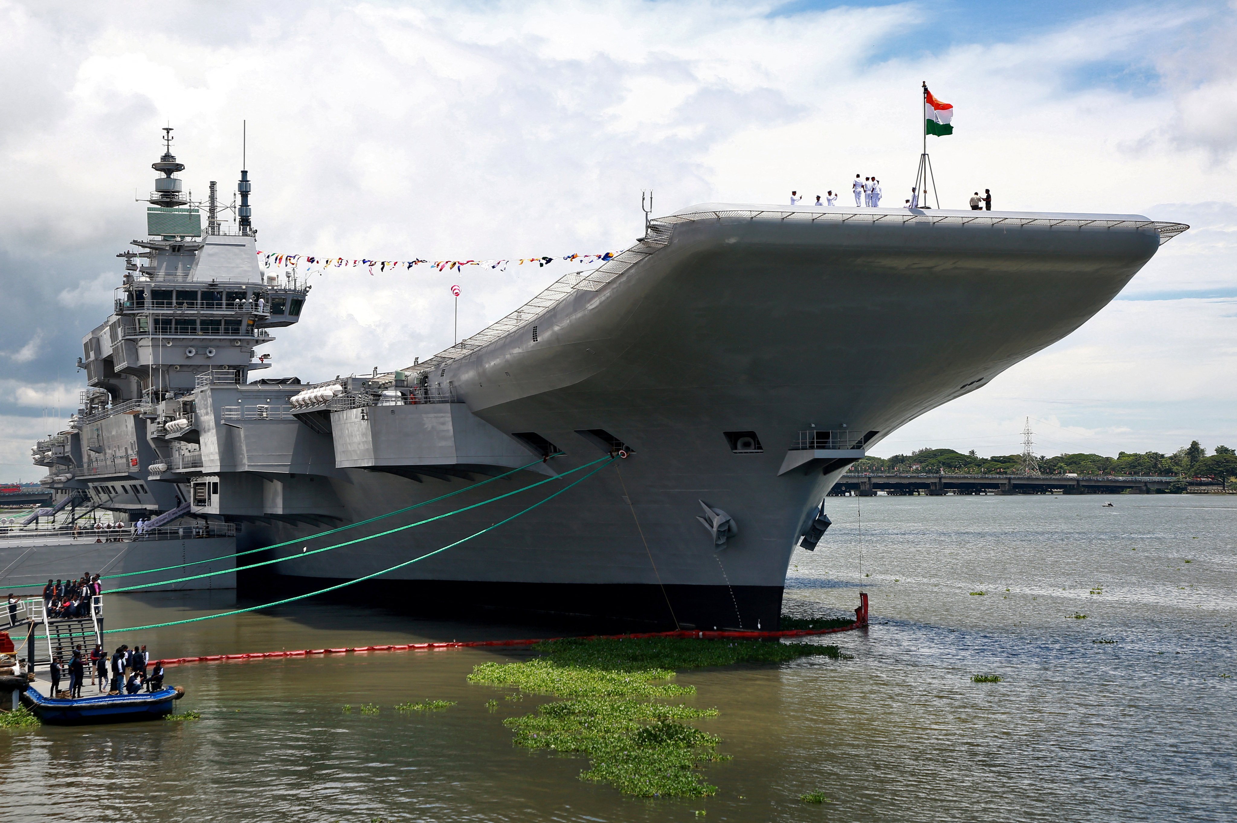Indian Navy officers stand on the flight deck of India’s first home-built aircraft carrier INS Vikrant after its commissioning ceremony at a state-run shipyard in Kochi, India, on September 2. Photo: Reuters