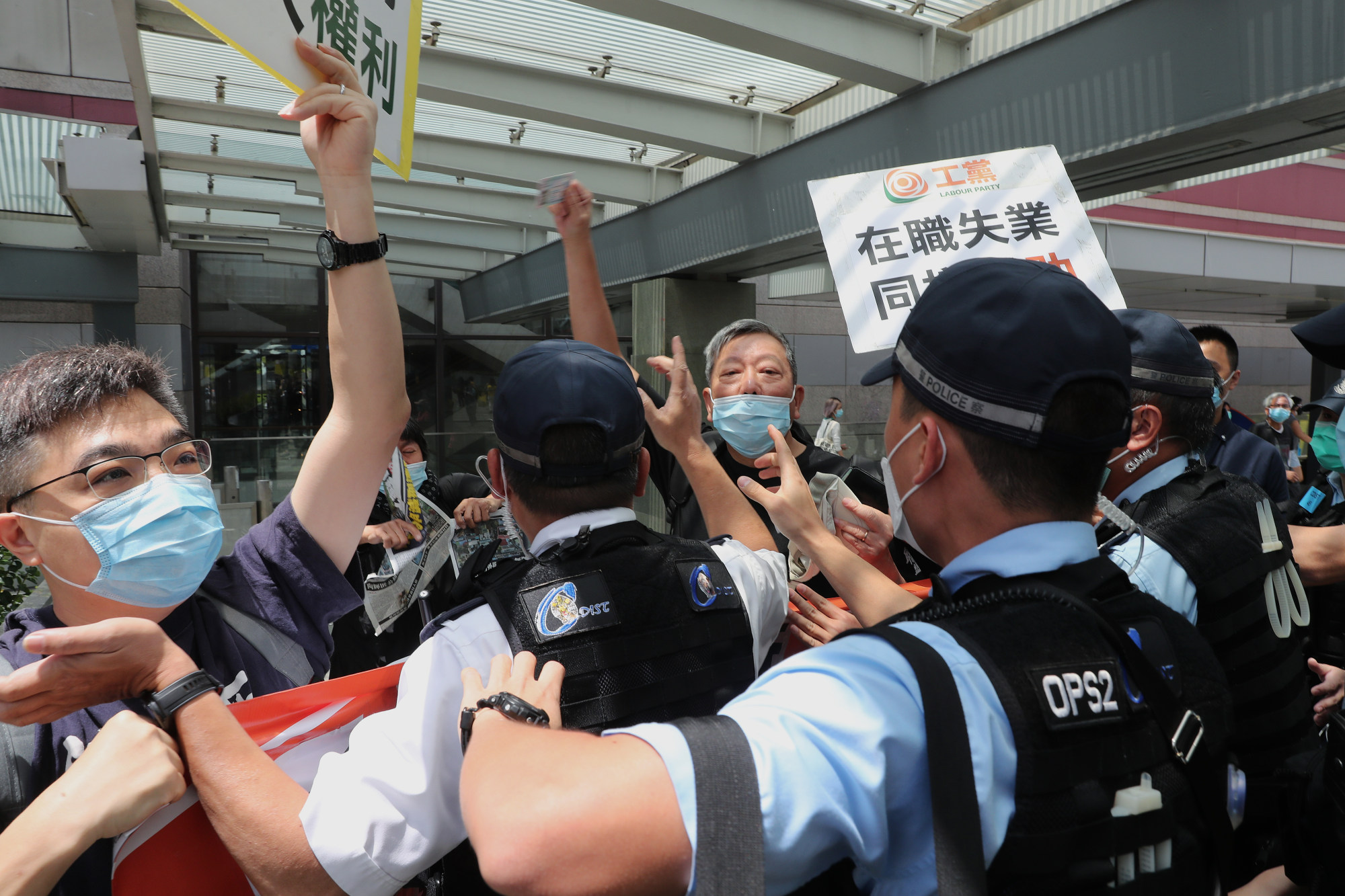 Activist Lee Cheuk-yan (centre) and members of the Labour Party protest against a decision to ban an annual march amid the coronavirus pandemic in May 2020. Photo: Sam Tsang