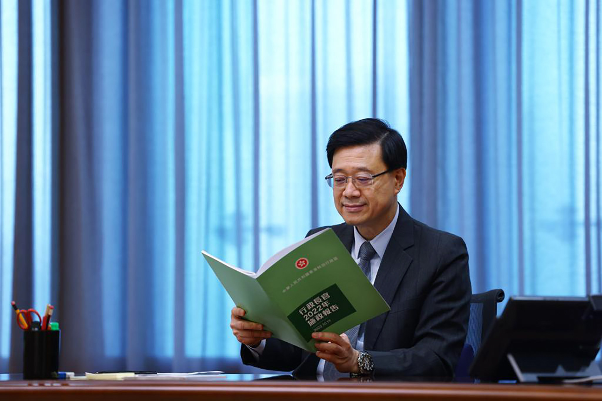 Chief Executive John Lee goes over his first policy address, to be delivered on Wednesday. Photo: Handout
