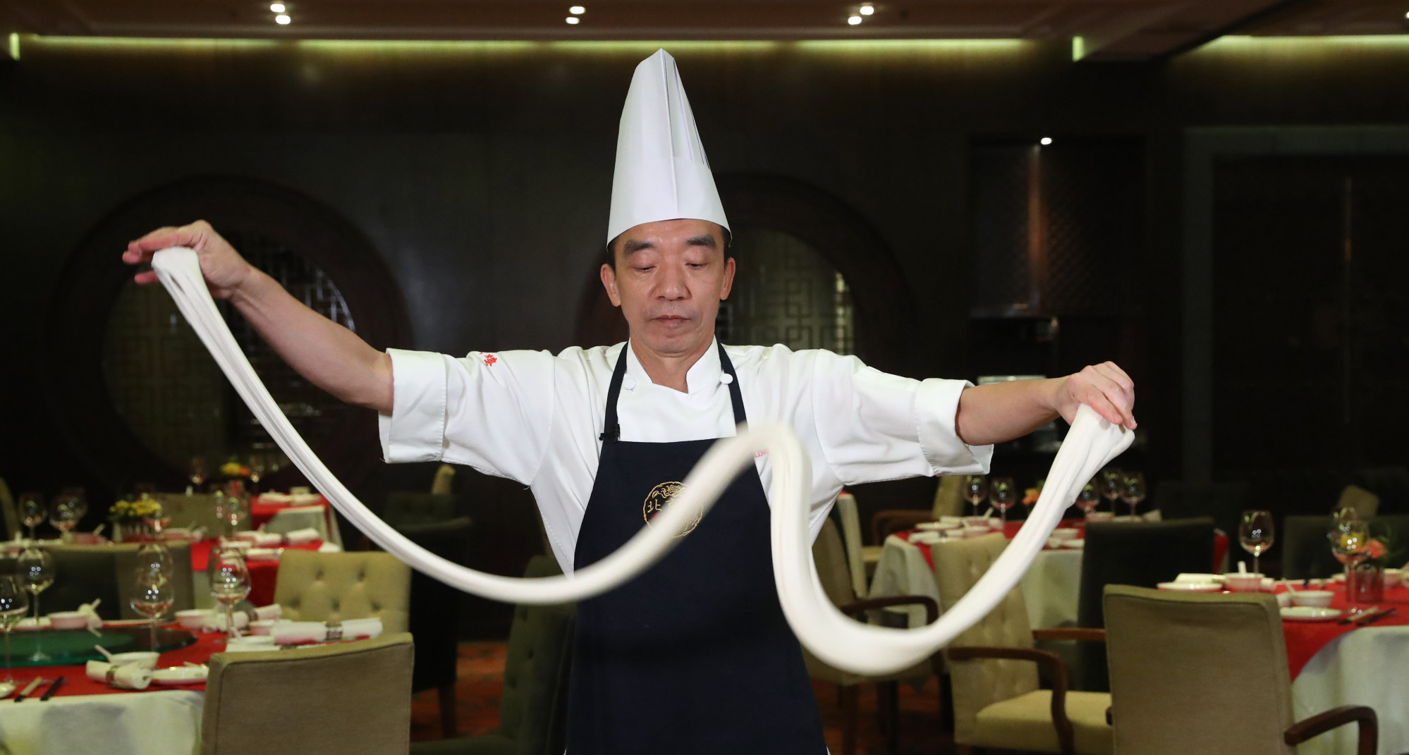 Chef Leung Chi-cheung at Hong Kong restaurant Peking Garden makes hand-pulled noodles. Photo: K.Y. Cheng