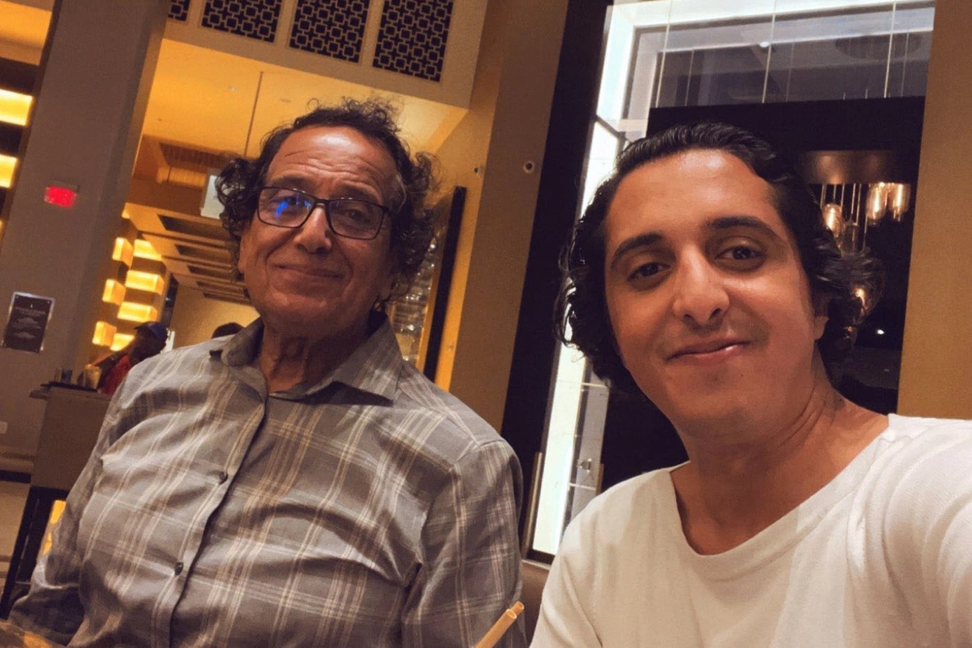 Saad Ibrahim Almadi with his son, Ibrahim. Photo: Ibrahim Almadi via Twitter