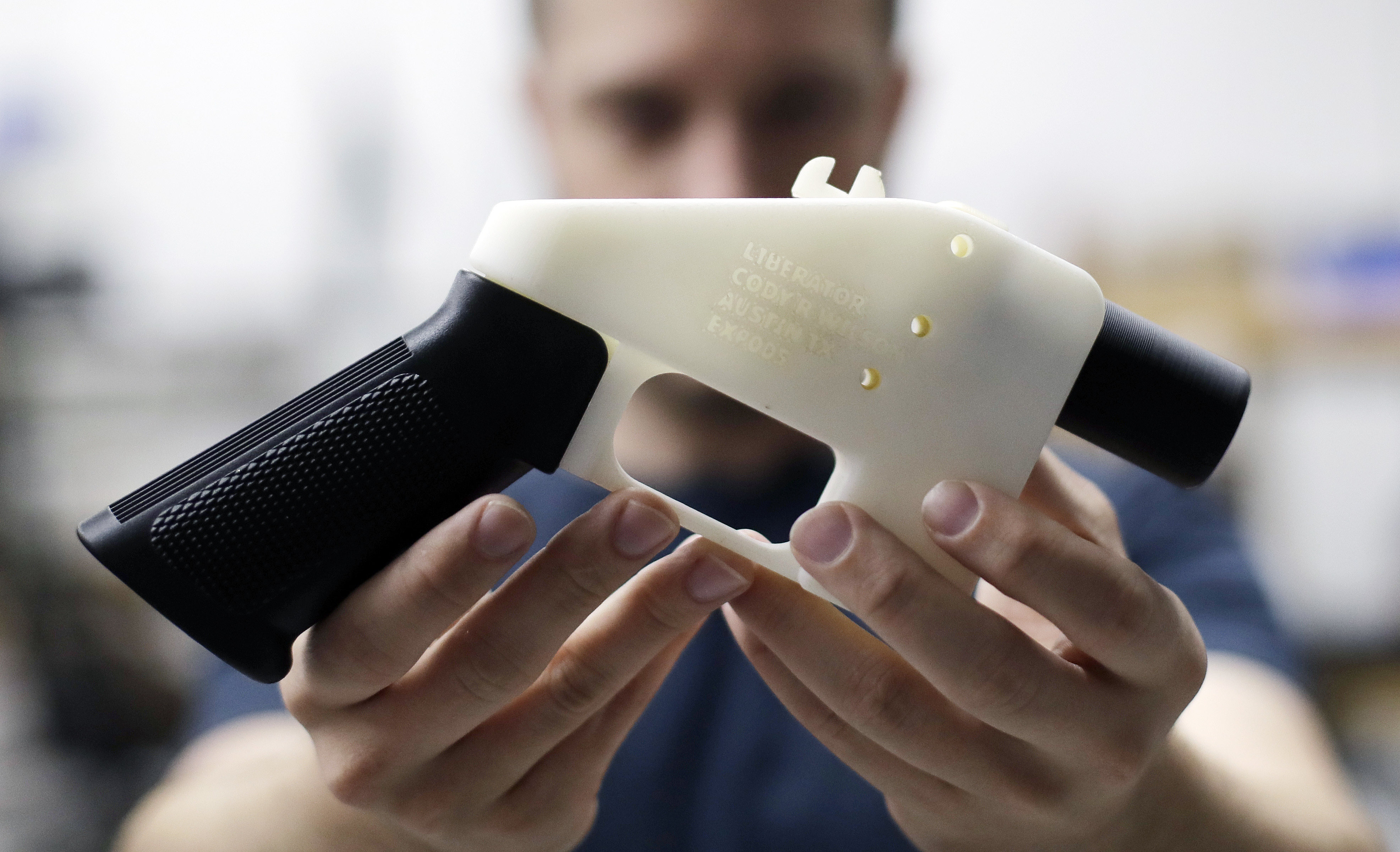Cody Wilson holds a 3D-printed gun called the Liberator. File photo: AP