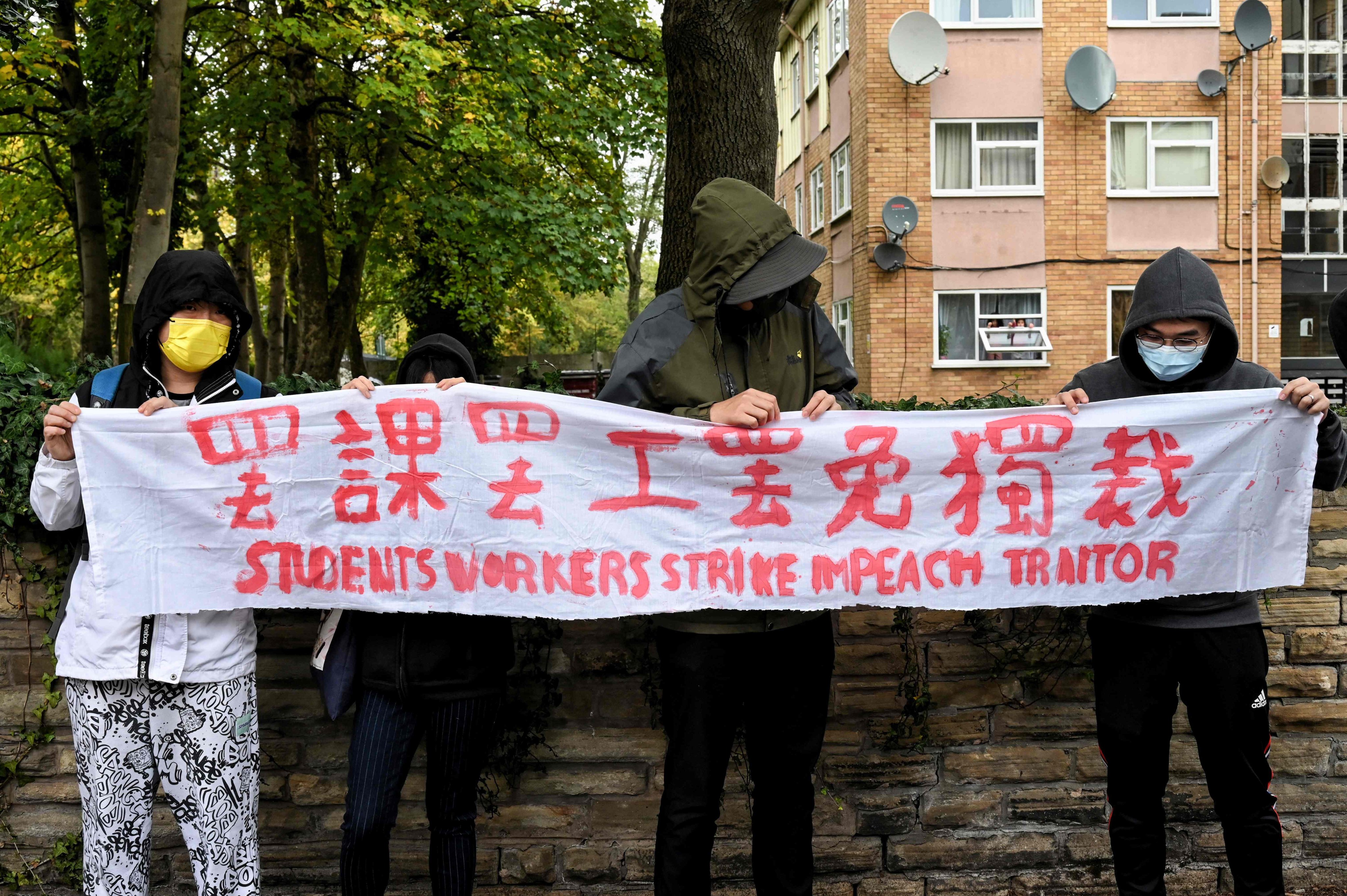 Pro-democracy protesters taking part in a demonstration outside the Chinese consulate in Manchester. Photo: AFP