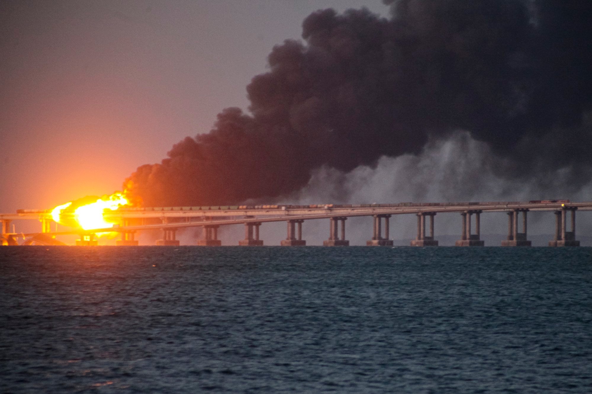 Smoke rises after an explosion on the Crimean Bridge connecting the Russian mainland and the Crimean peninsula, on October 8, 2022. Photo: AP Photo