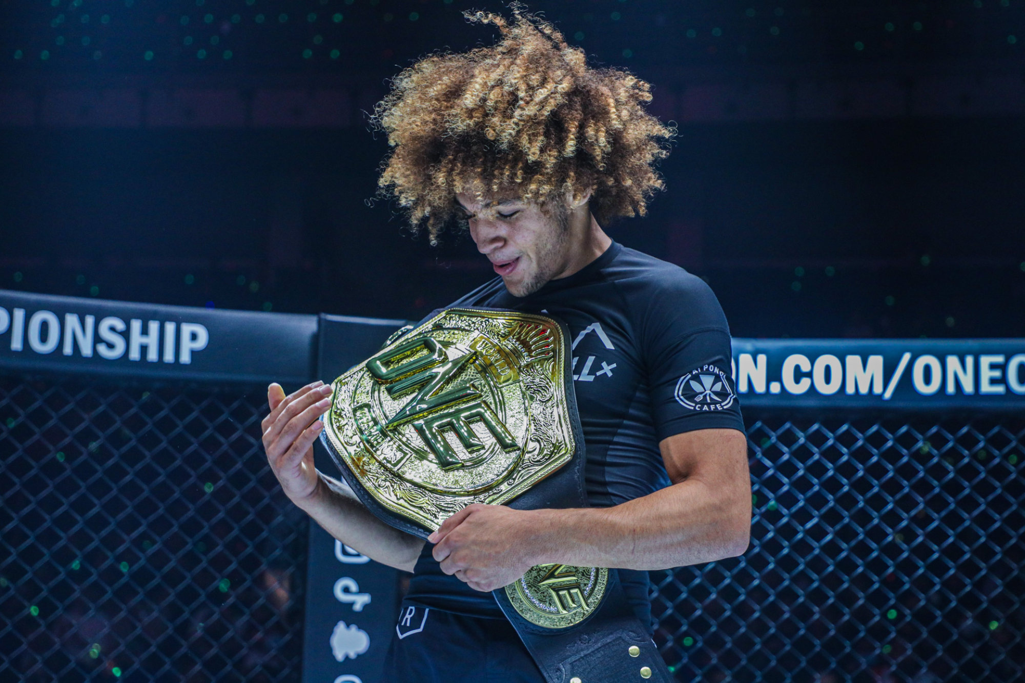 Kade Ruotolo looks at his title after becoming the inaugural lightweight sumission grappling champion.