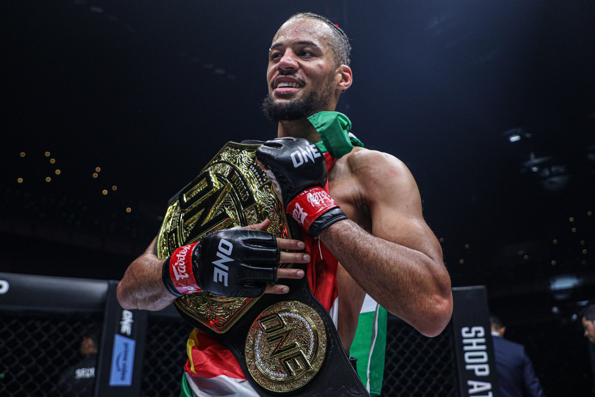 Regian Eersel celebrates after winning the lightweight Muay Thai title.