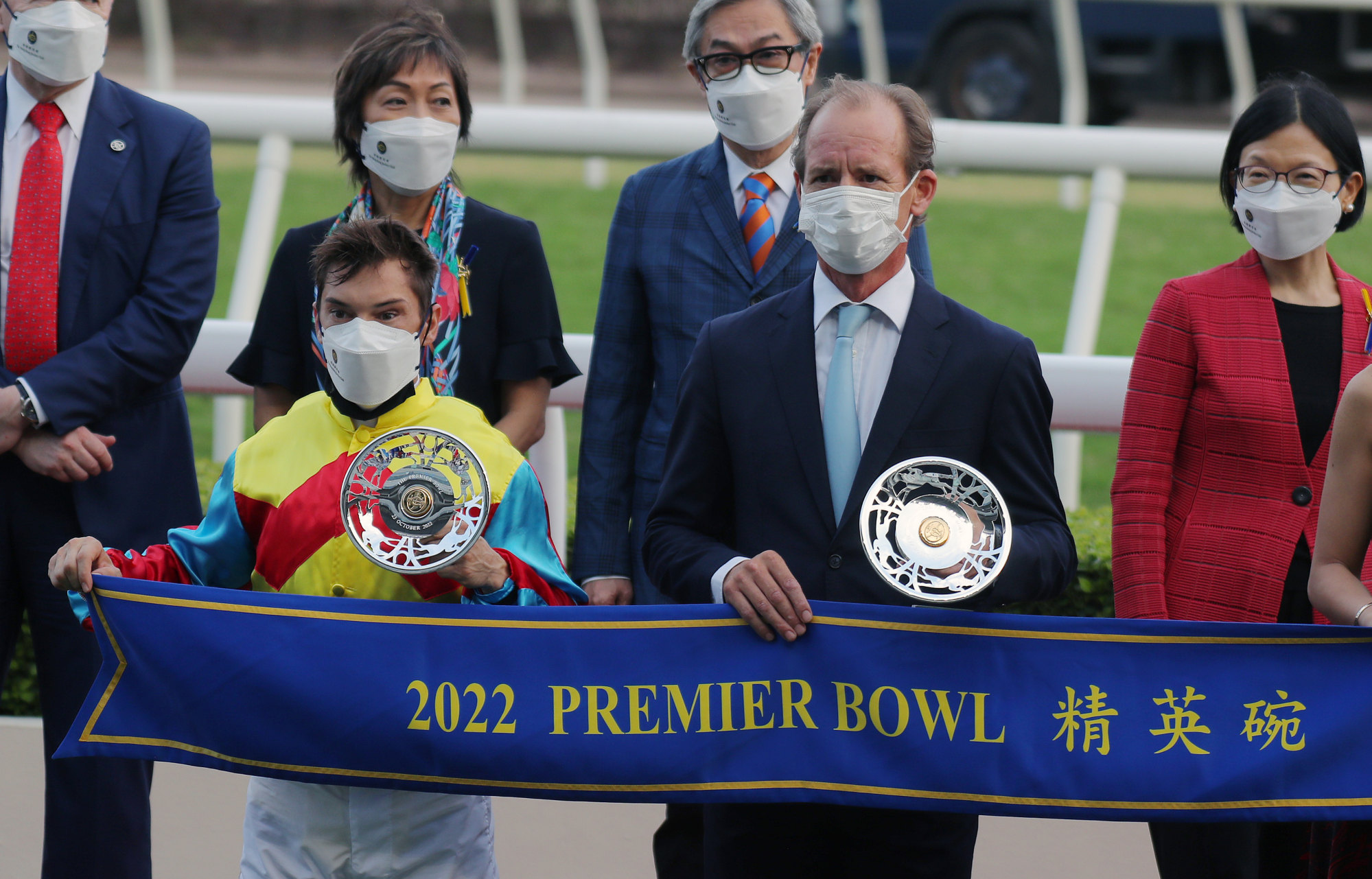 Alexis Badel and Richard Gibson receive their Group Two Premier Bowl (1,200m) trophies following Wellington’s win.