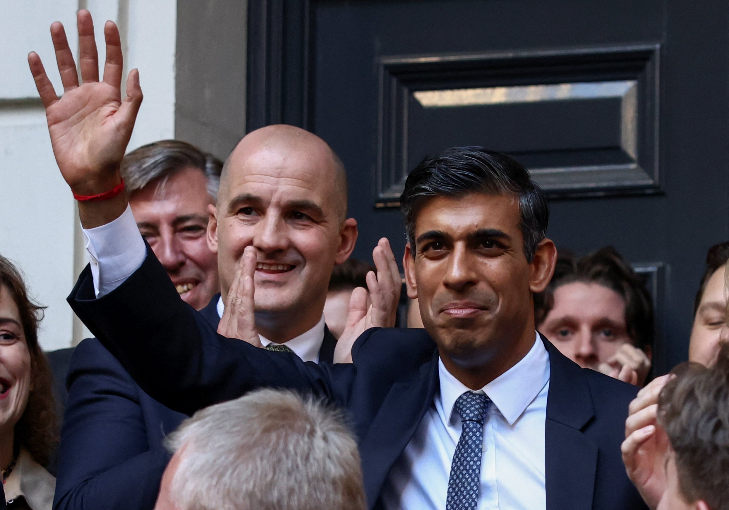 New leader of Britain’s Conservative Party Rishi Sunak waves outside the party’s headquarters in London on Monday. Photo: Reuters