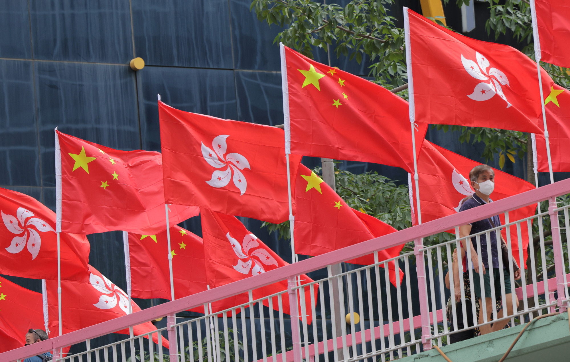 State and city flags line a bridge in Wan Chai. Photo: Jelly Tse