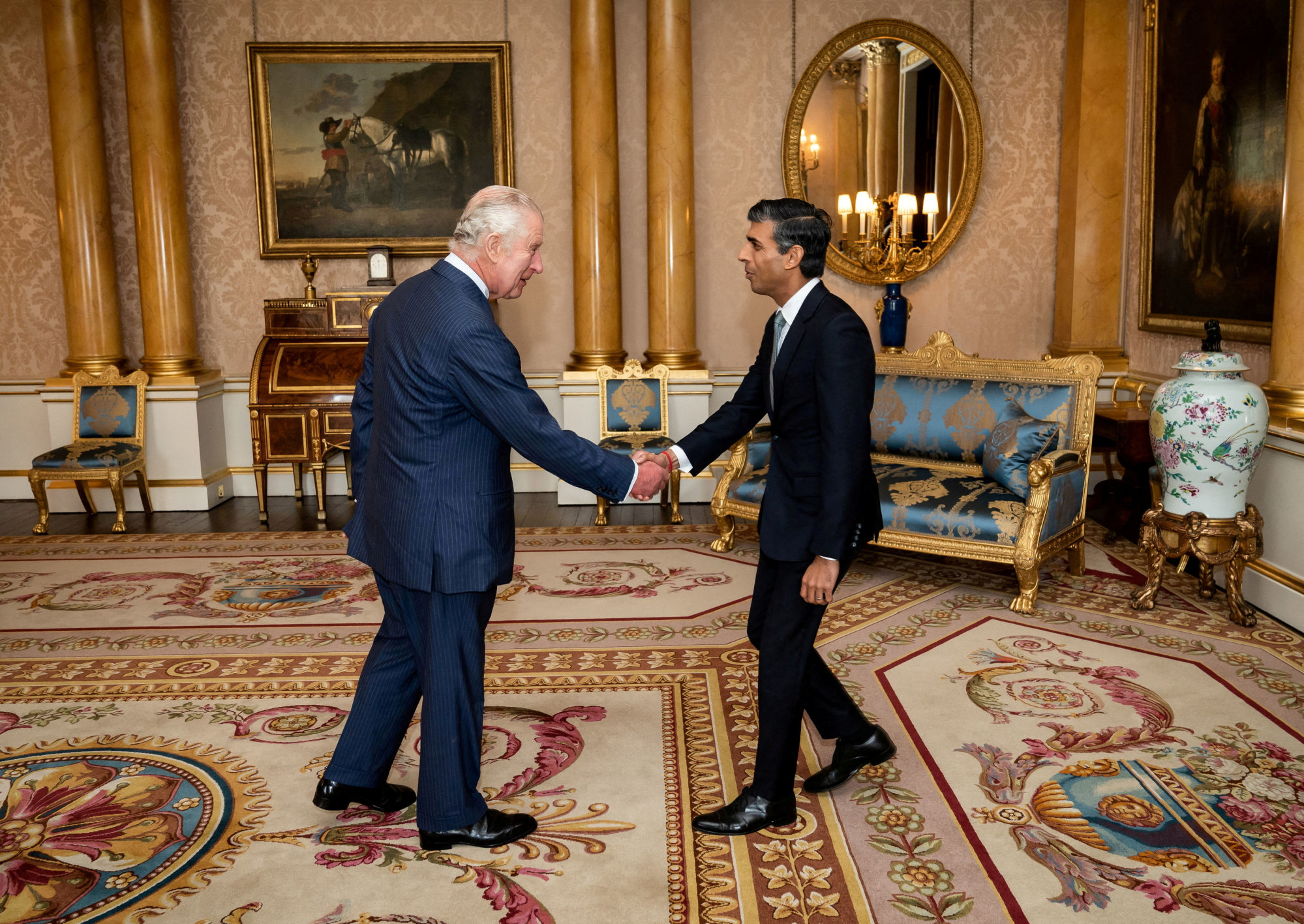 King Charles welcoming Rishi Sunak to Buckingham Palace on Tuesday. Photo: Reuters