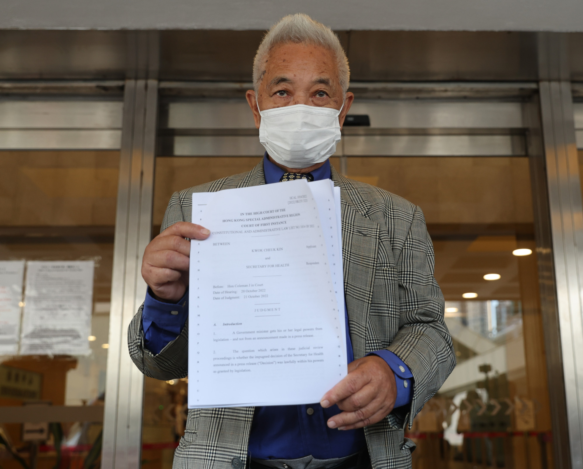 Retired civil servant Kwok Cheuk-kin outside the High Court after he won a judicial review of the government’s invalidation of vaccinations exemption certificates. Photo: Yik Yeung-man