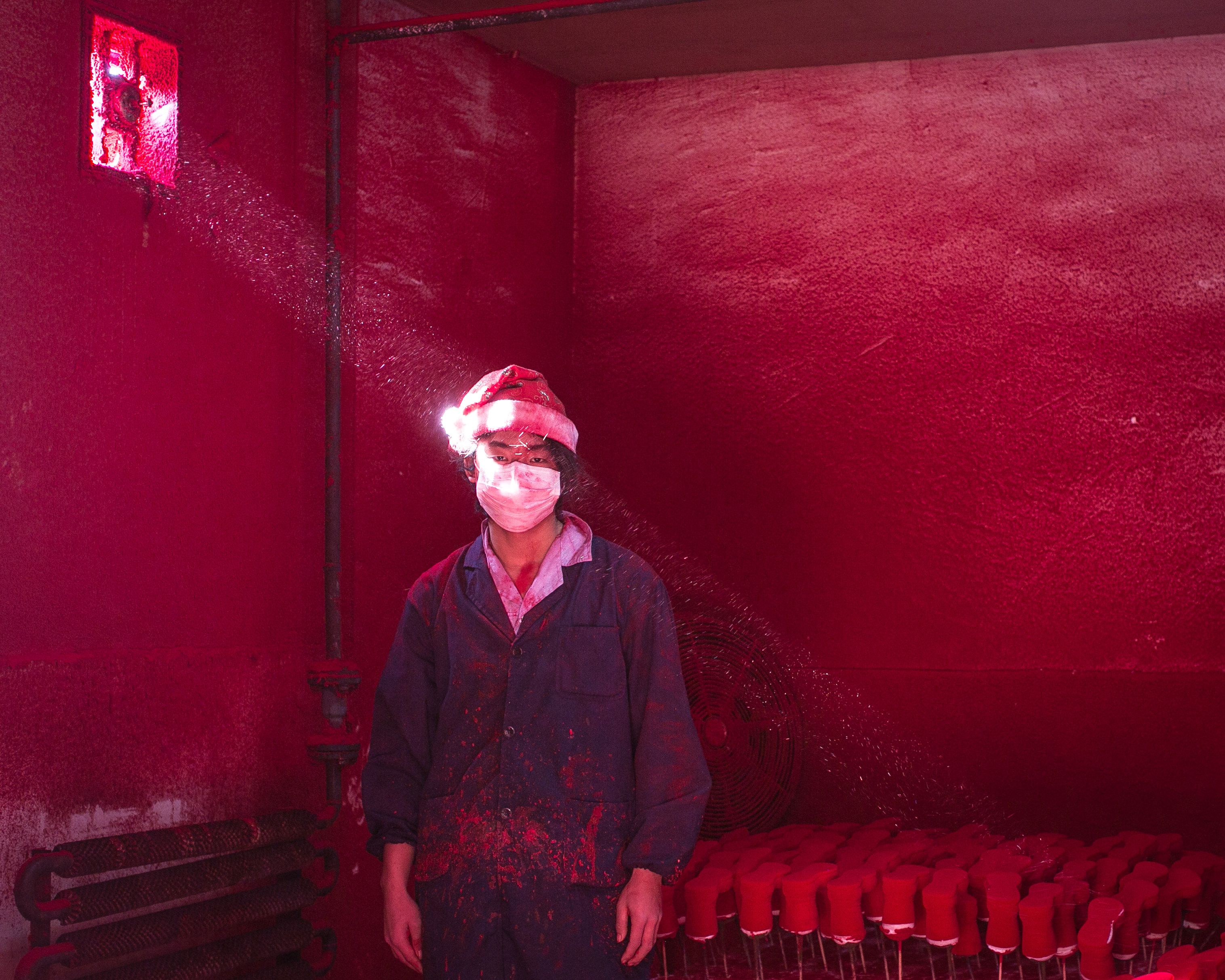 —ONE TIME USE ONLY NO SALES—&#xA;&#xA;On December 6, 2014, at the Yiwu Christmas Factory, 19-year-old Xiao Wei wore a Christmas hat and a mask to work in dusty workshop. He typically goES through six masks per day.&#xA;&#xA;Credit: Chen Ronghui