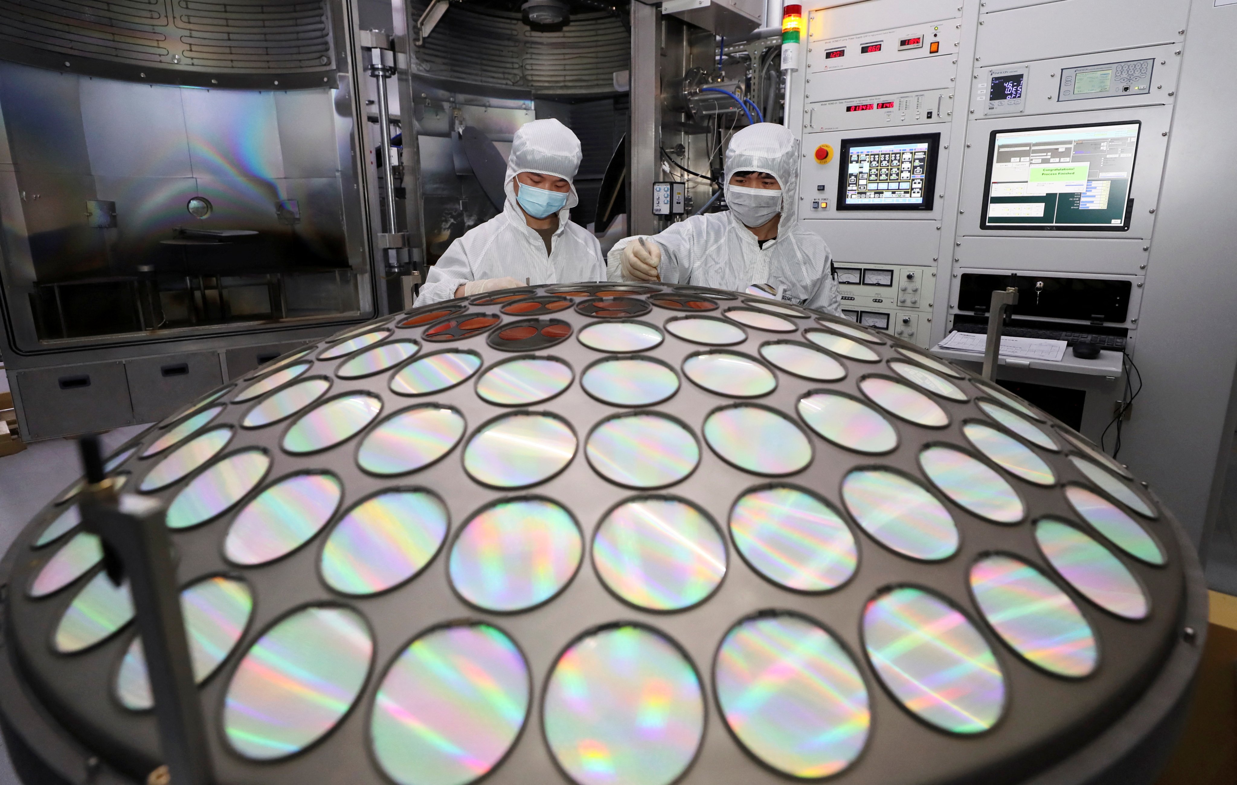 Employees work on the semiconductor chip production line of Jiangsu Azure Corp in Huaian, Jiangsu province. Photo: China Daily via Reuters