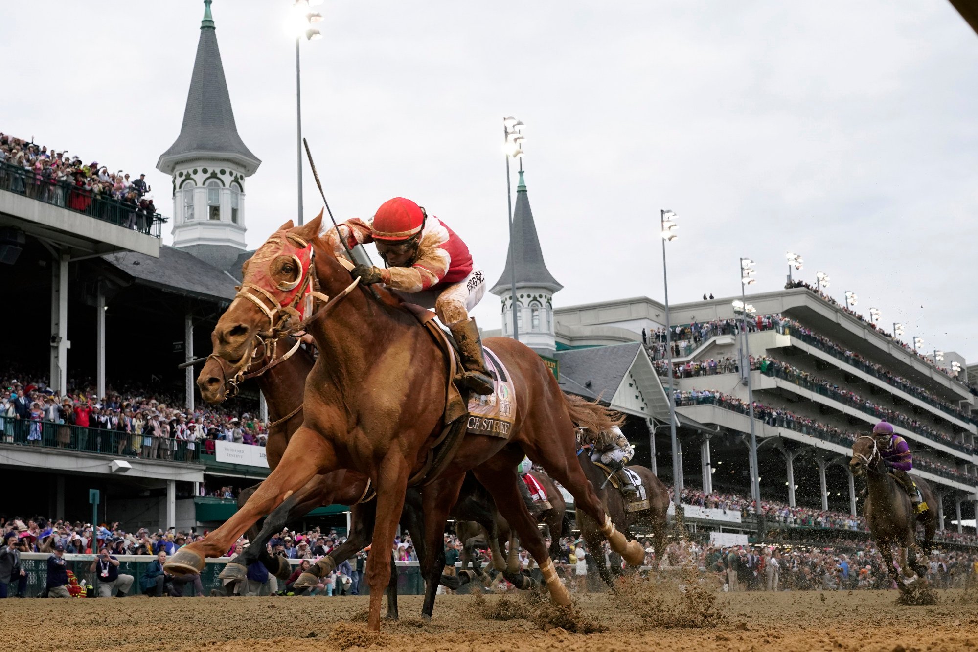 FILE - Rich Strike, with Sonny Leon aboard, crosses the finish line to win the 148th running of the Kentucky Derby. Photo: AP