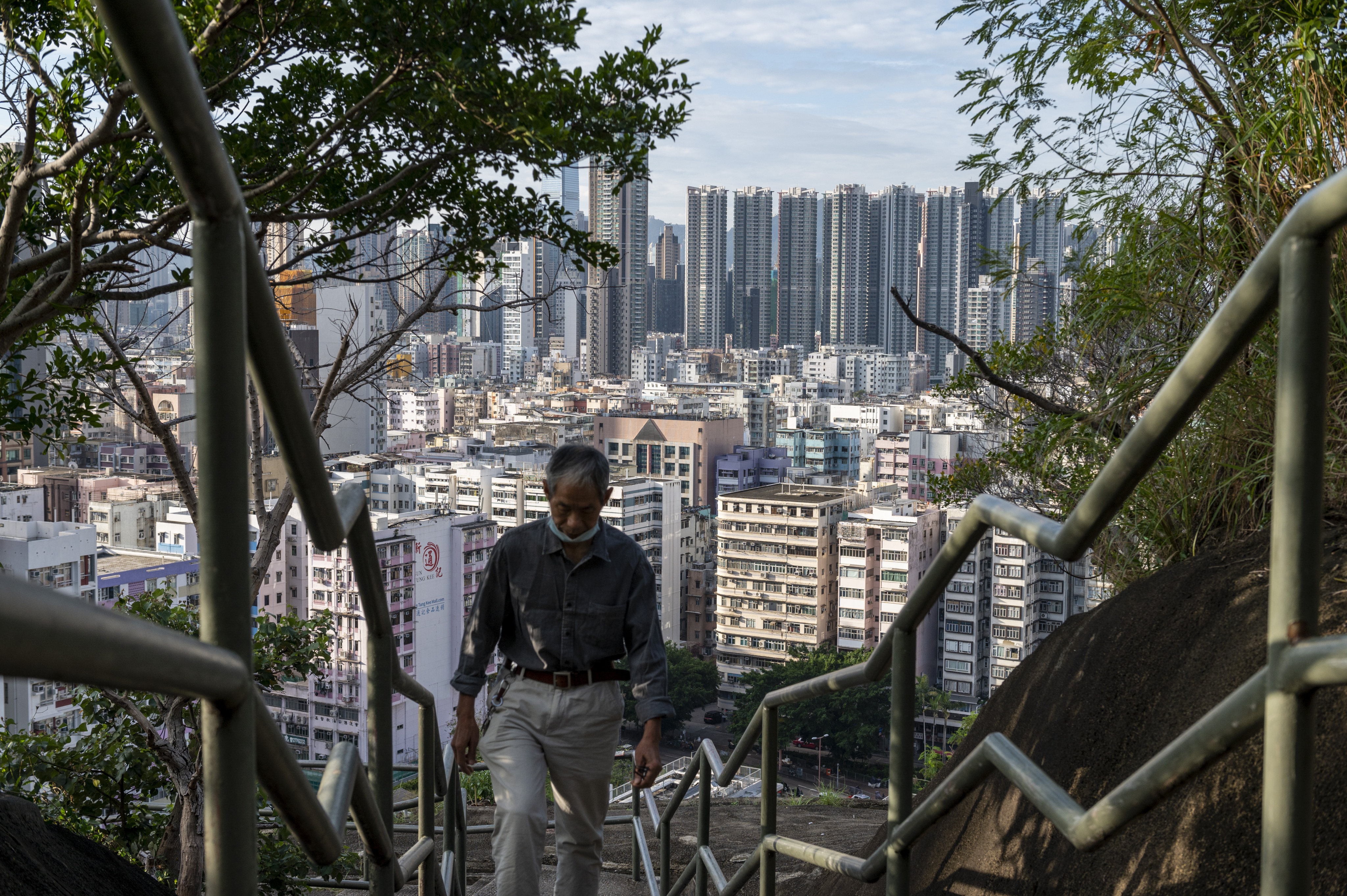 A man climbs steps near a residential area in Hong Kong on October 19. Photo: AP 
