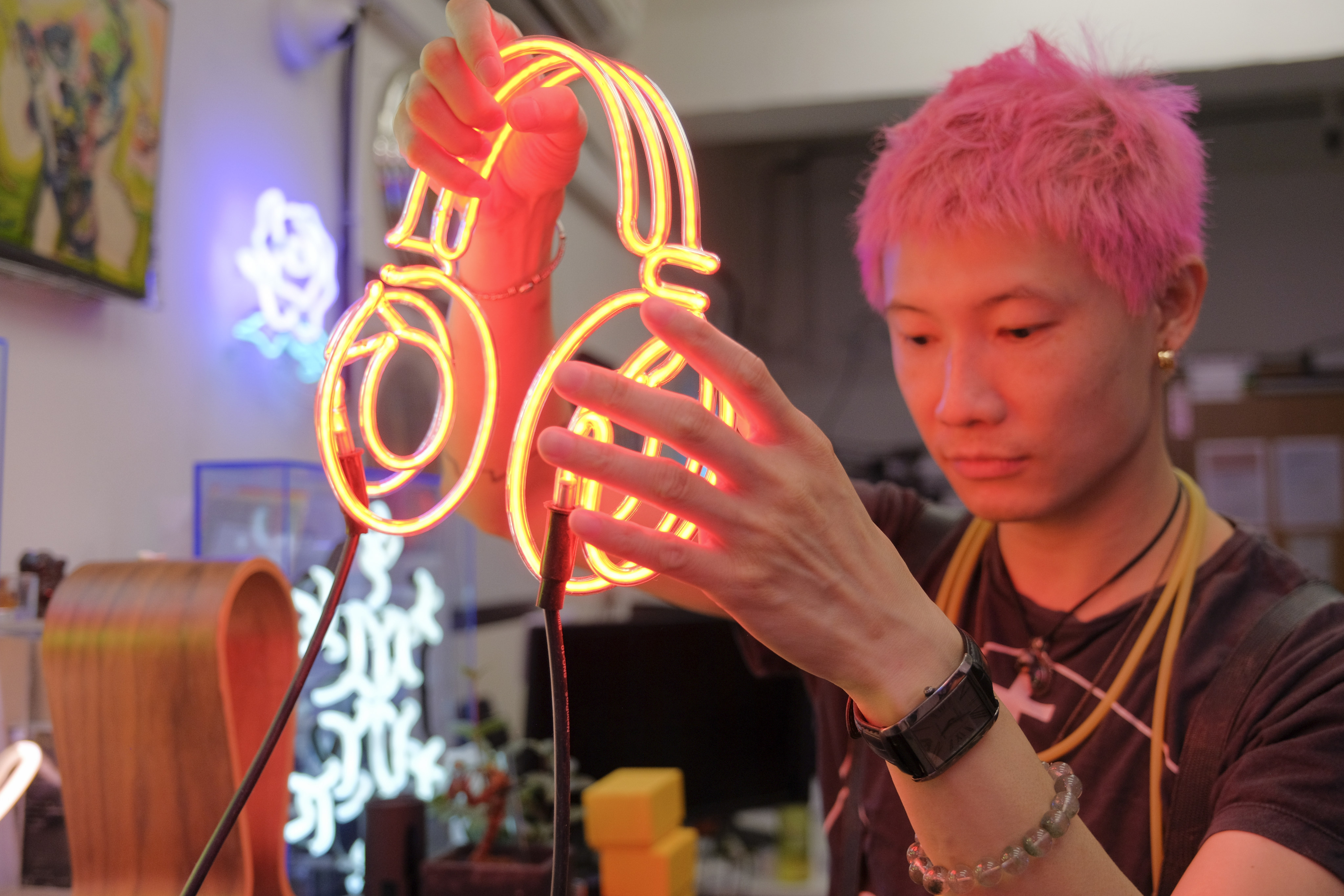 Jive Lau Ho-fai teaches neon-bending workshops at Kowloneon, a neon workspace in Kwun Tong, Hong Kong. Photo: Connor Mycroft