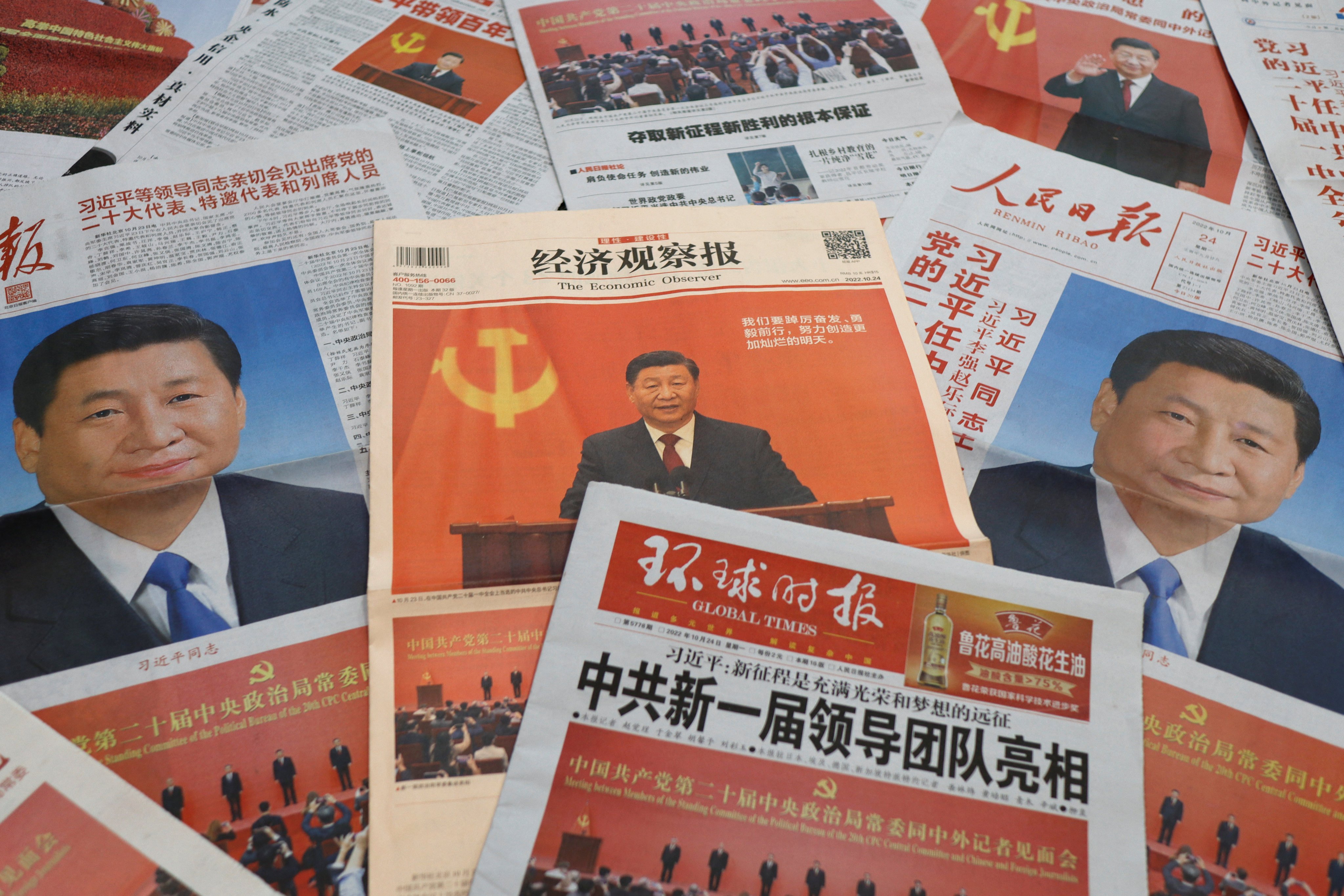 Newspaper reports on the new Politburo Standing Committee led by Chinese President Xi Jinping. Photo: Reuters