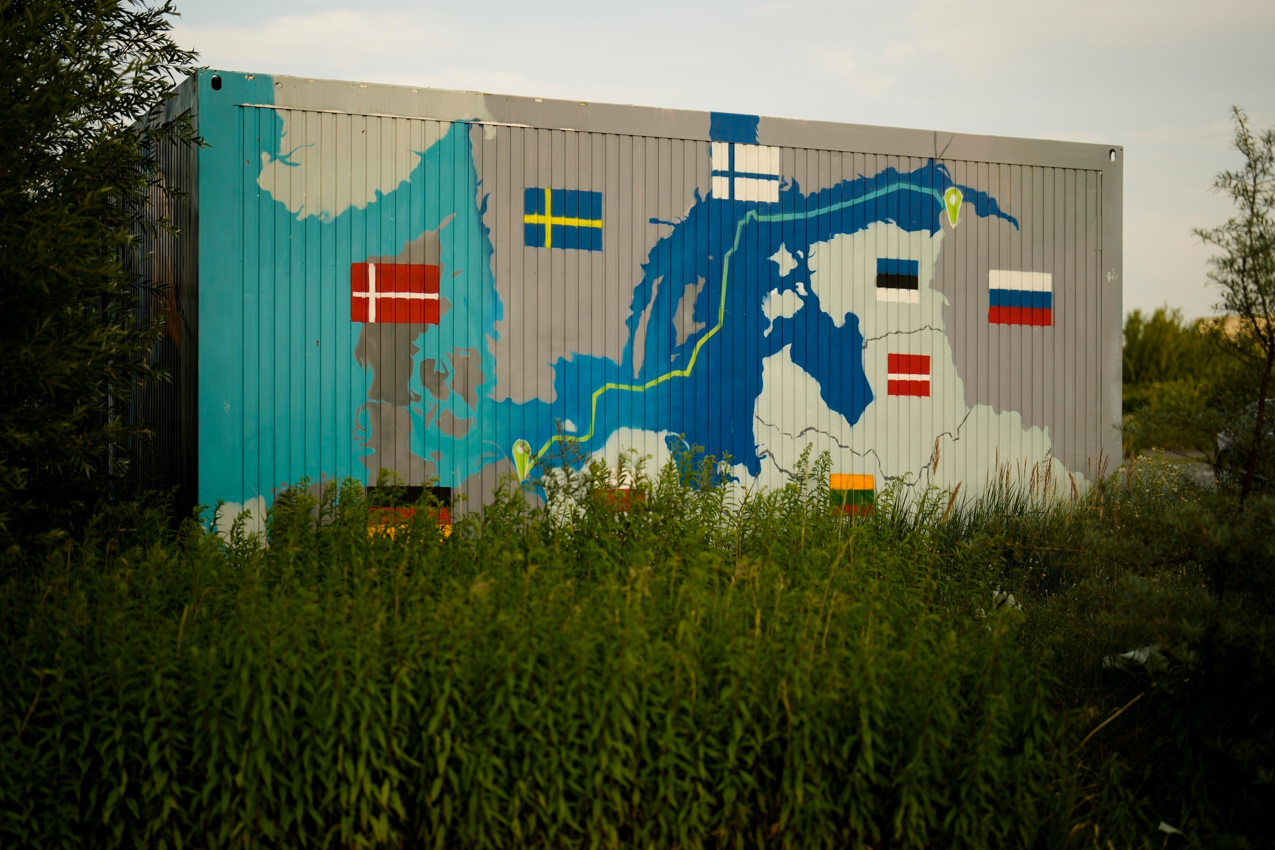 A painting showing the Nord Stream pipelines on a container near the Nord Stream 1 Baltic Sea pipeline in Lubmin, Germany, on July 20. The prospect of a winter plagued with power cuts is driving home the potential danger of weaponised interdependence to many in western Europe and beyond. Photo: AP