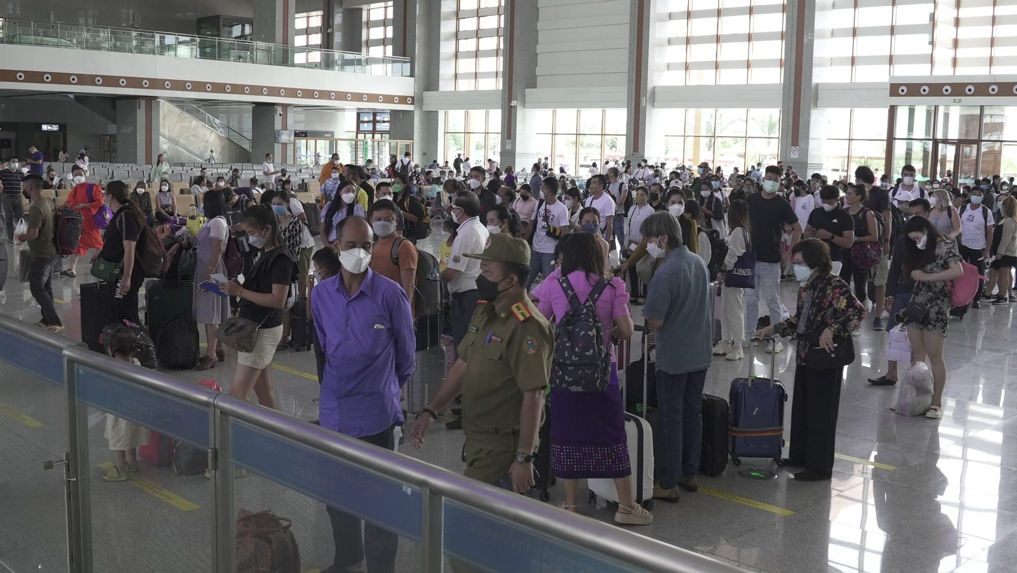 Passengers in Laos wait to board the high-speed train at Vientiane station. Photo: Aidan Jones