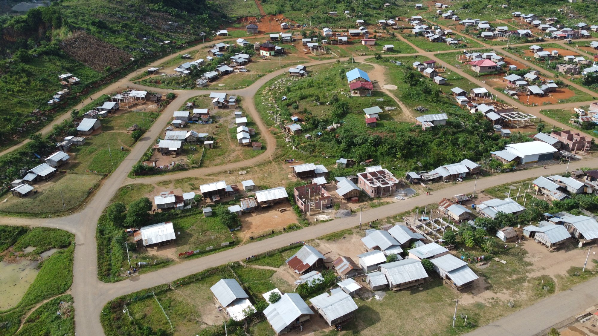 Aerial view of a village in Laos’ Oudomxay province, whose residents had to move to make way for a hydropower scheme. Photo: Aidan Jones