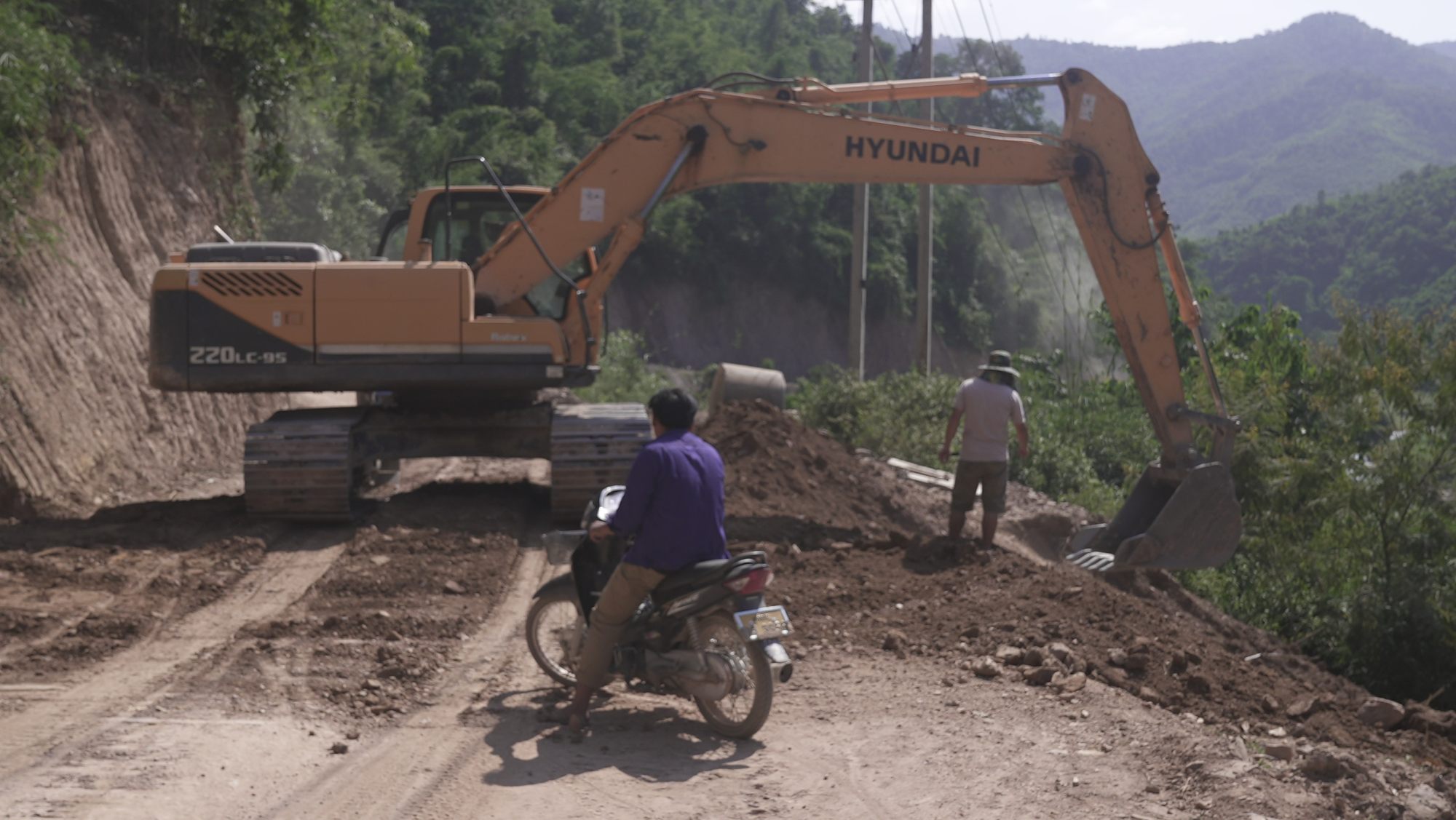 Road-building in the remote hills of Laos’ Oudomxay province to allow trucks to reach a new Chinese mining concession. Photo: Aidan Jones