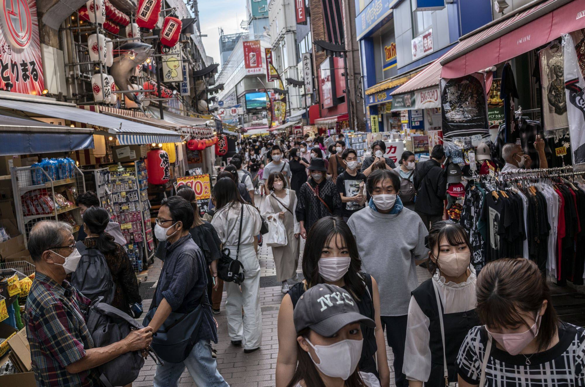 Shoppers in Tokyo, Japan, on September 16. The Japanese currency could have a good deal further to fall before it bottoms out. Photo: Bloomberg