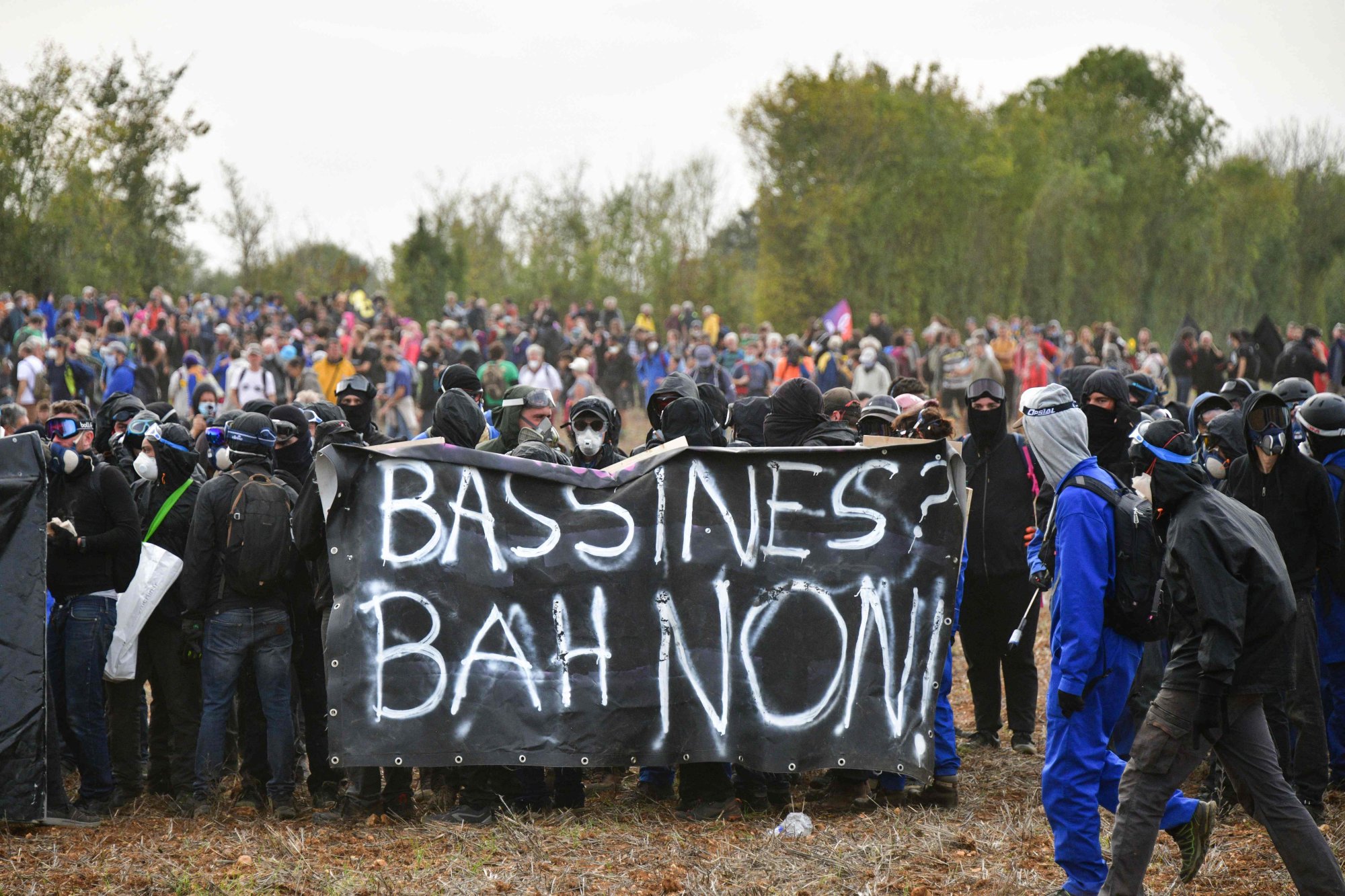 Activists hold a banner reading “Basins, well no!” during a demonstration in Sainte-Soline, western France on Saturday. Photo: AFP