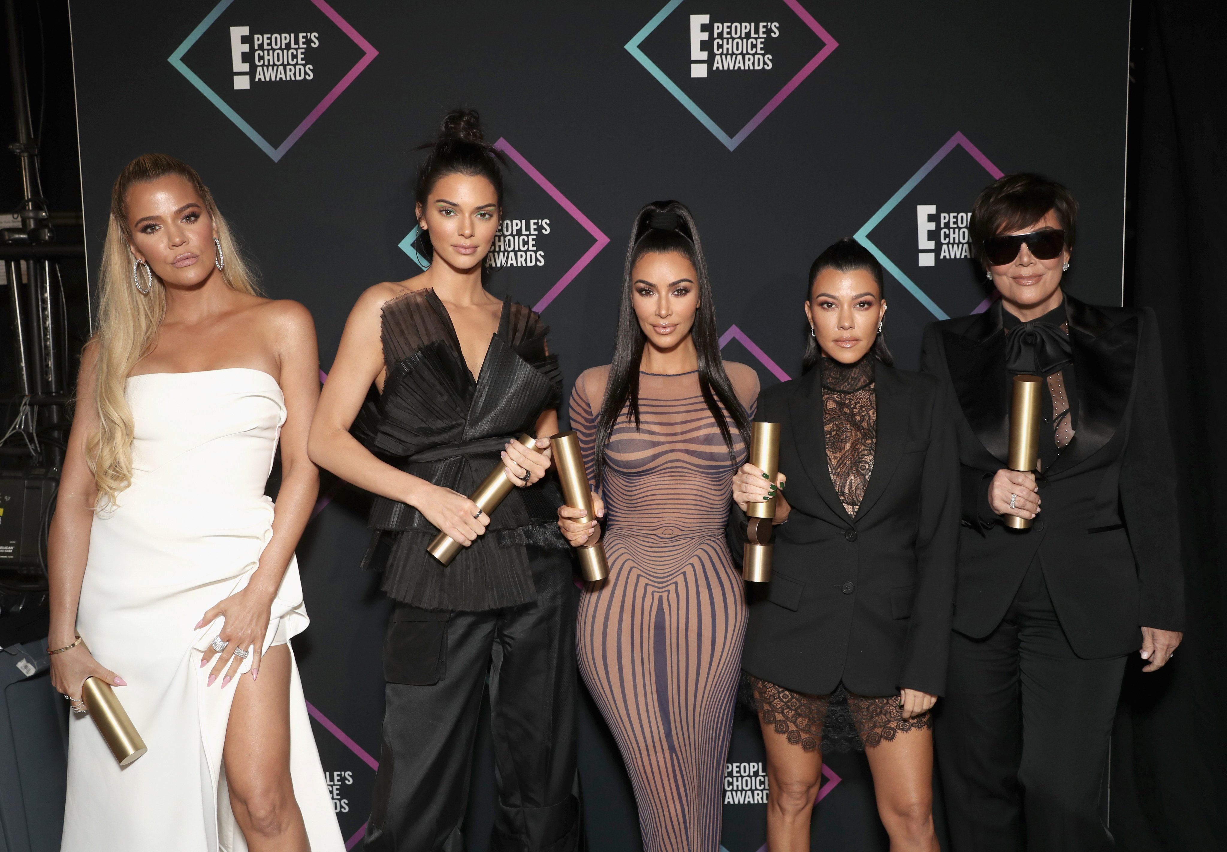 SANTA MONICA, CA - NOVEMBER 11:  2018 E! PEOPLE&apos;S CHOICE AWARDS -- Pictured: (l-r) Khloe Kardashian, Kendall Jenner, Kim Kardashian, Kourtney Kardashian and Kris Jenne, winners of the Reality Show of 2018 for &apos;Keeping Up With The Kardashians&apos; pose backstage during the 2018 E! People&apos;s Choice Awards held at the Barker Hangar on November 11, 2018 --  NUP_185073  --  (Photo by Todd Williamson/E! Entertainment/NBCU Photo Bank/NBCUniversal via Getty Images)